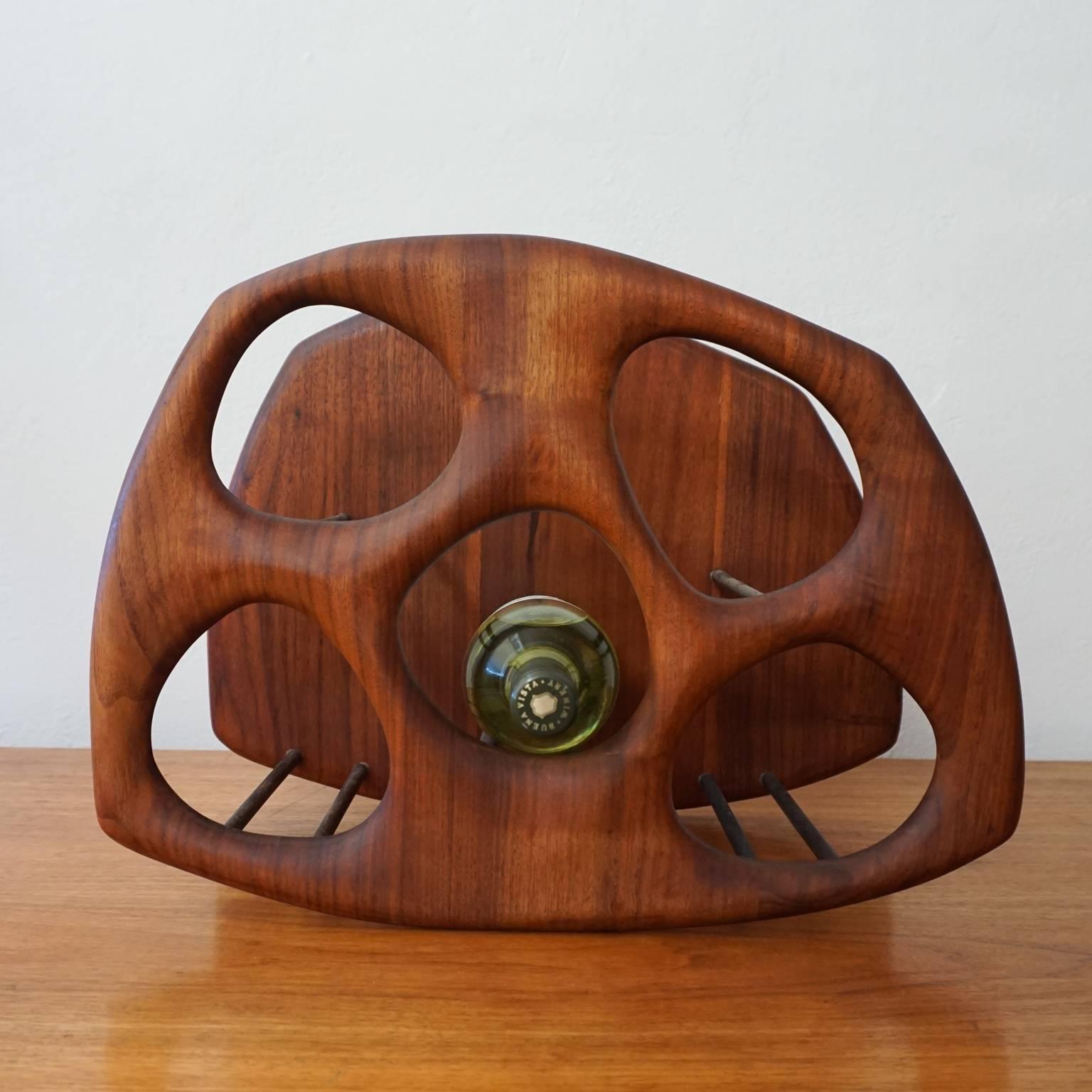 Handmade solid walnut wall-mounted wine rack. Skillfully crafted.

Designed by California woodworker, Dean Santner. Dean recounts selling the racks, early in his career, in front of Cody’s Bookstore on Berkeley’s Telegraph Avenue in 1970-1971.
