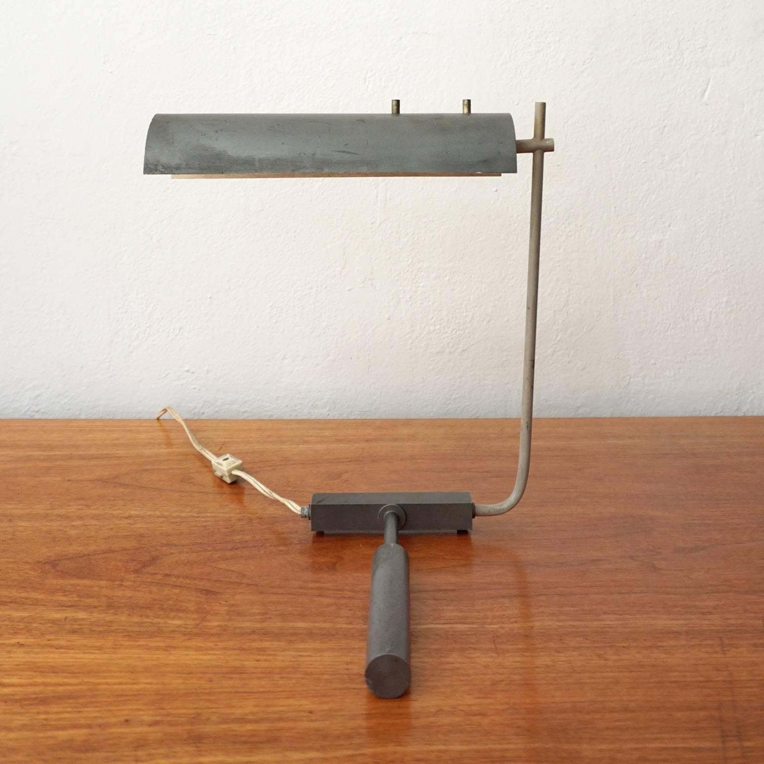 Minimalist desk lamp by J.J.M. Hoogervorst for Dutch company, Anvia. Hoogervorst's designs for Anvia were influenced by Arredoluce, Stilnovo, and Arteluce. However, this particular lamp, which is referred to as the piano lamp, evokes more of a De