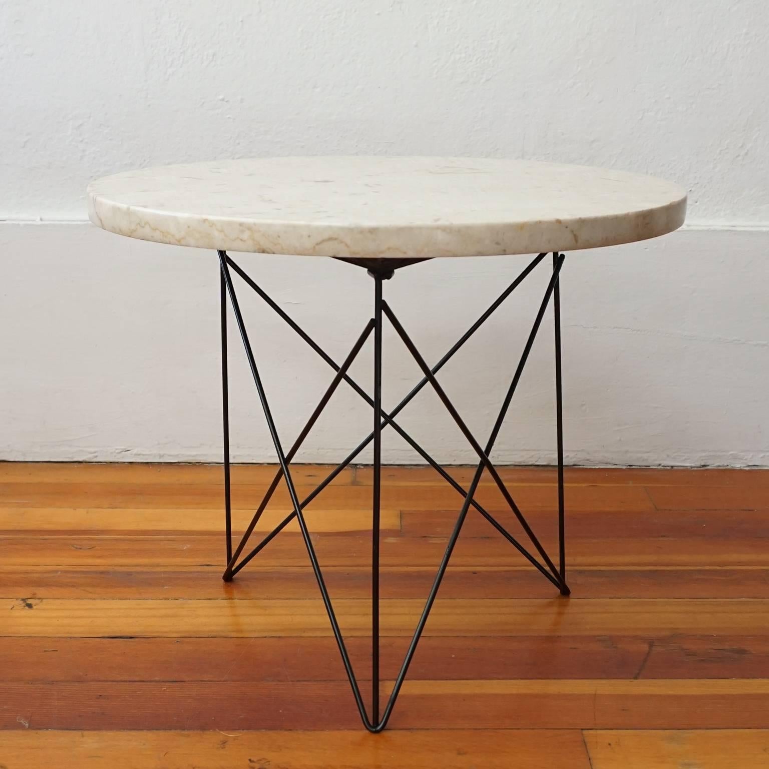 Criss-cross tripod base with marble top side table by Martin Perfit for Rene Brancusi Inc, 1950s.
