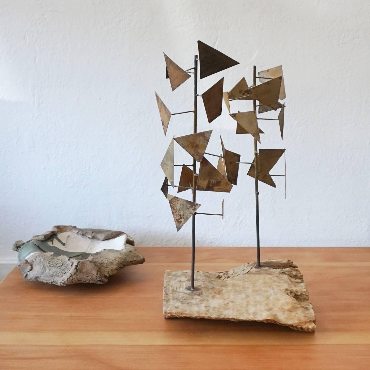 Welded metal abstract sculpture mounted on wood. Unsigned, 1960s.