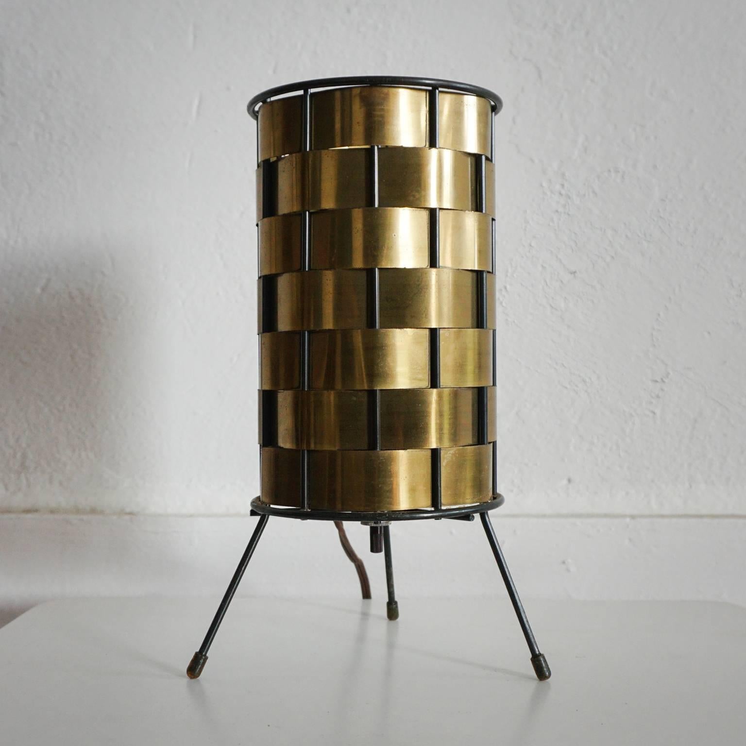 Woven brushed brass tripod lamp with a cylinder wire frame, 1950s.