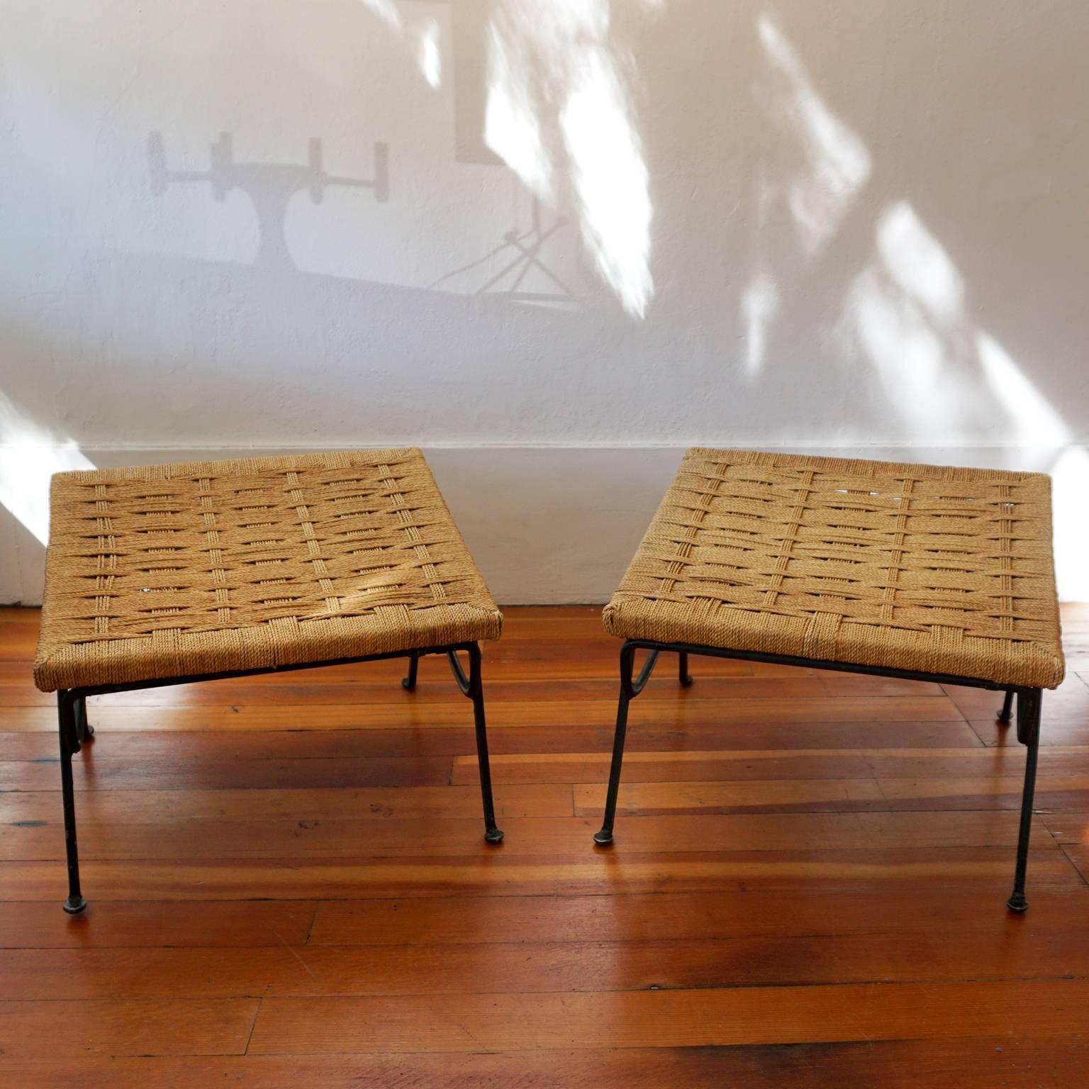 A pair of raffia and iron stools designed by Maurizio Tempestini for Salterini. Made in Italy, 1950s.

The 1950s photo is architect Paul R Williams sitting on the stool in his backyard.