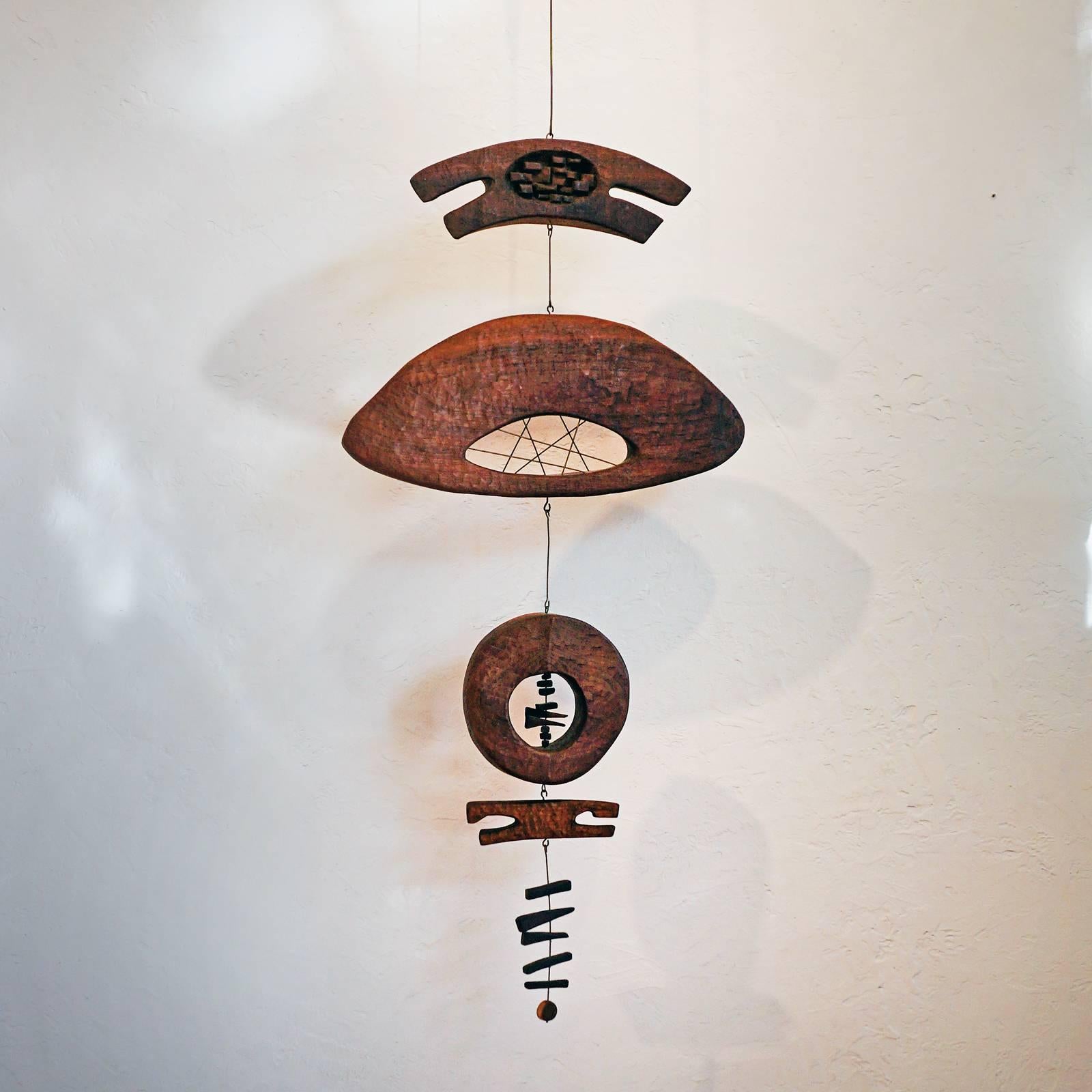 Carved wood and metal hanging sculpture by Kathy Haun, an original member of the Arizona Designer-Craftsmen. Please see the artist profile in photo seven.
 