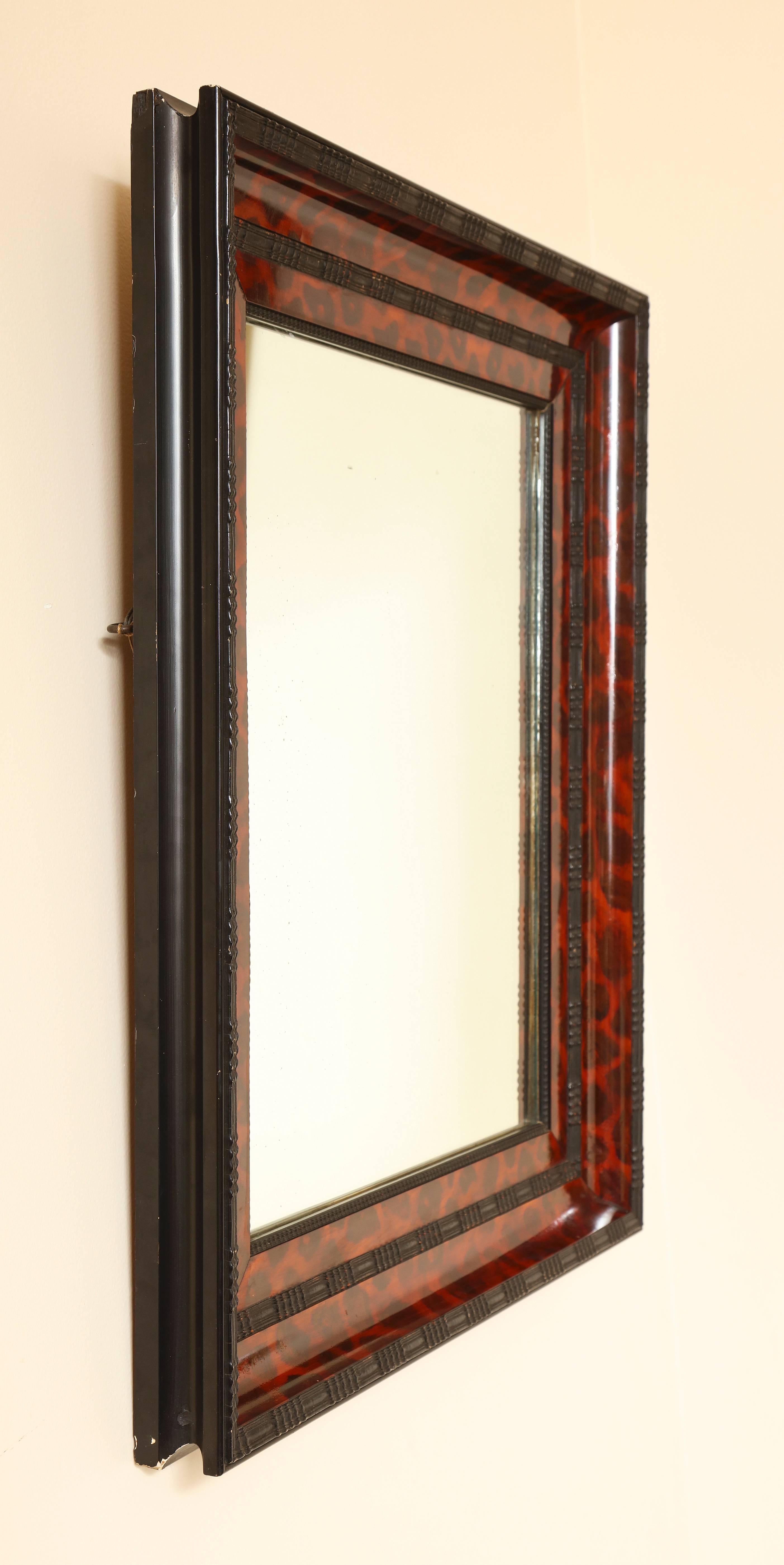 American Ebonized and Lacquered Faux Tortoise Shell Decorated Mirror Frame