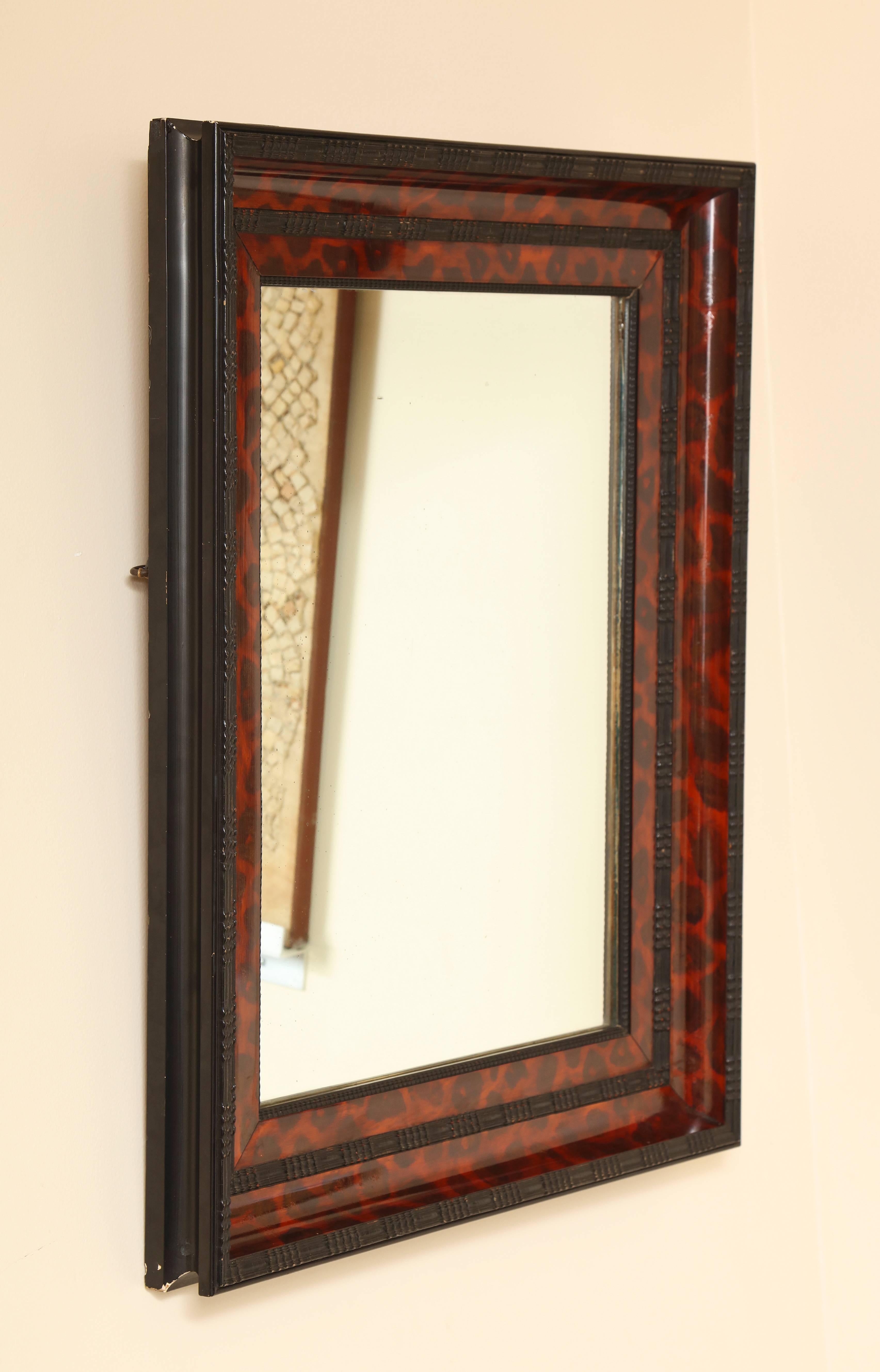 Mid-20th Century Ebonized and Lacquered Faux Tortoise Shell Decorated Mirror Frame