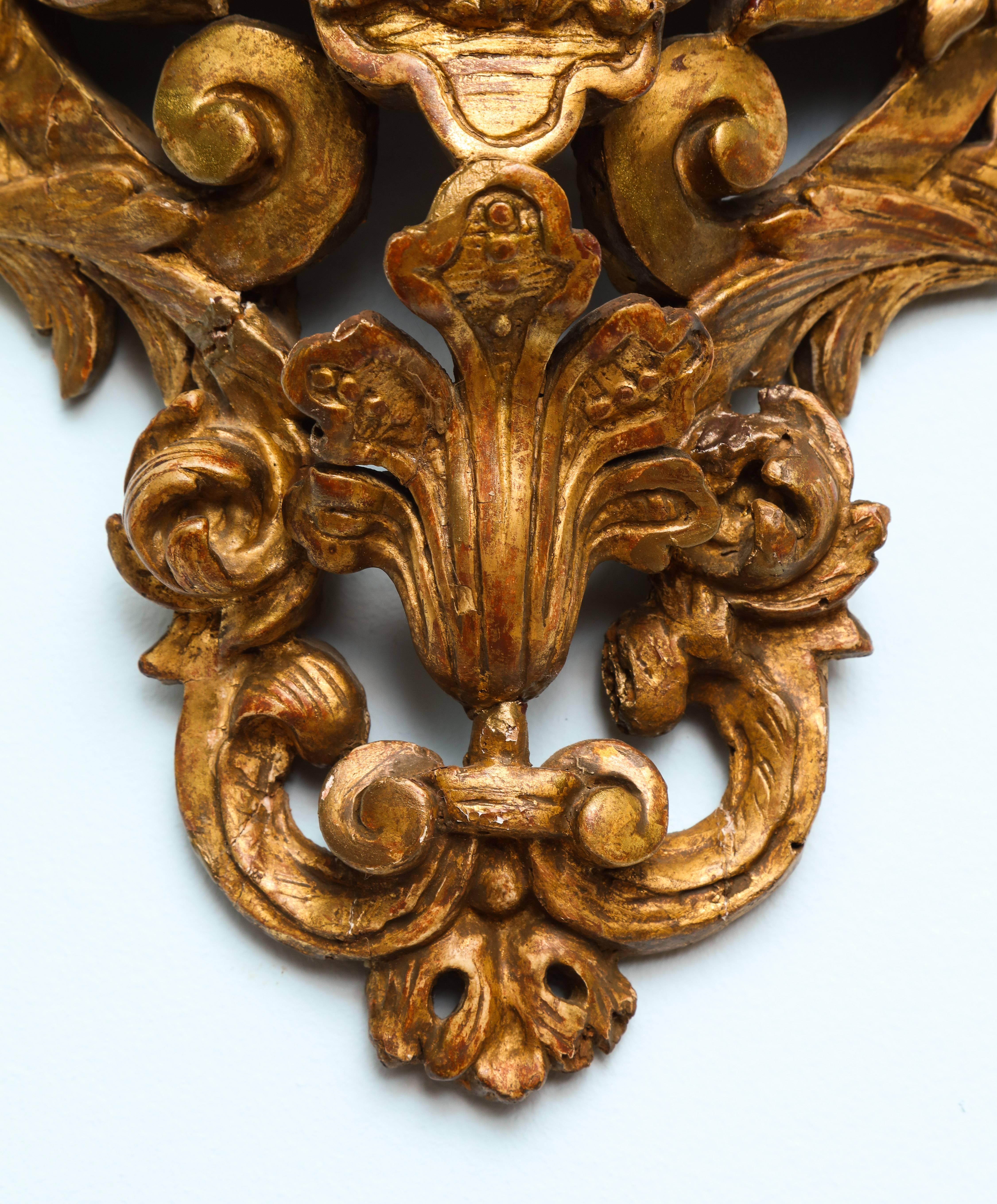 A finely carved French Regence painted and gilded wall bracket (console d’applique), with a central espagnolette and marble top,

France, circa 1720.

  