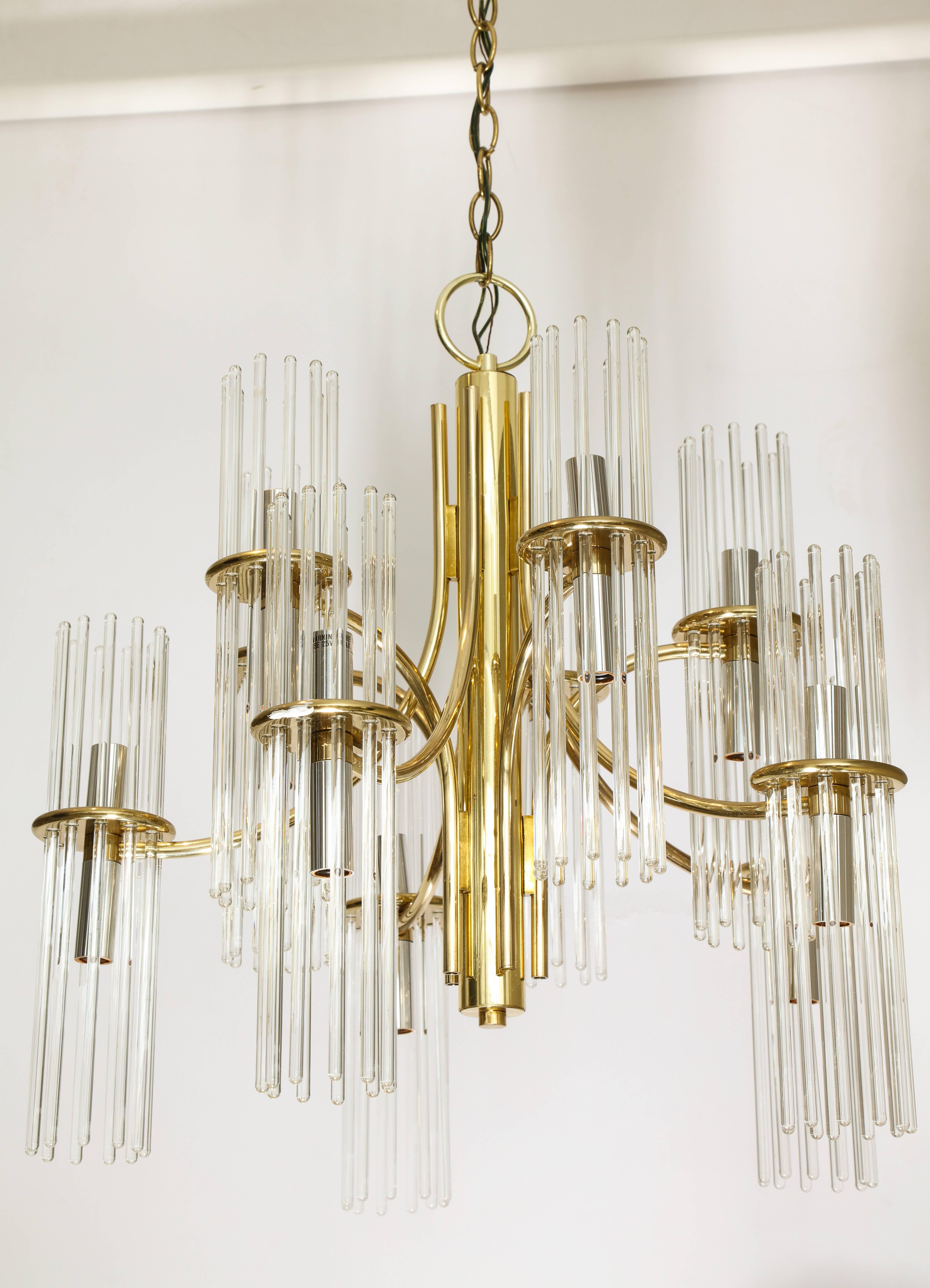 An Italian 1970s brass nine-arm chandelier with glass rod hanging prisms.
Size 23" high x 22" diameter.
 