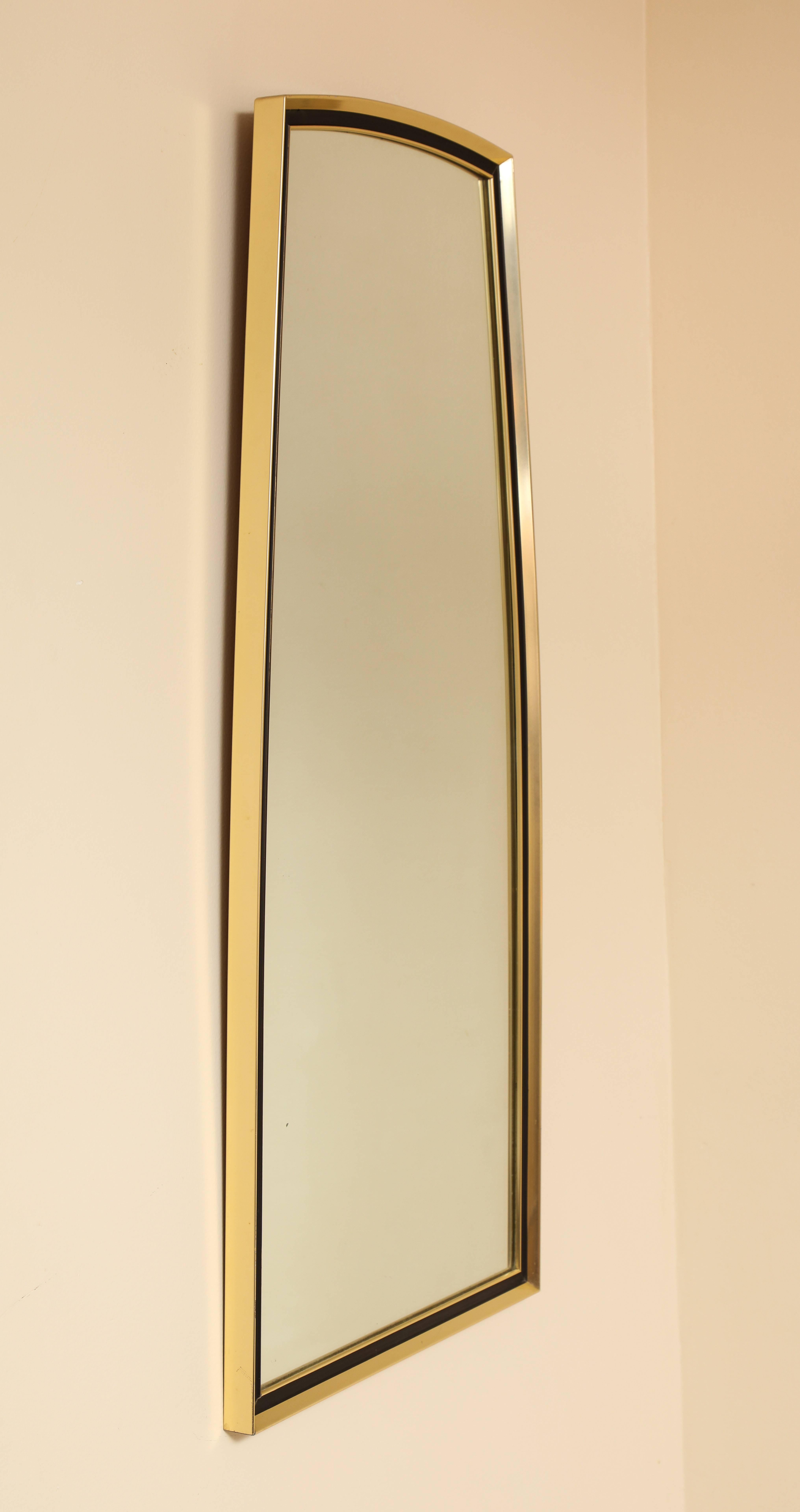 A gold and metal shaped wall mirror by Turner Manufacturing; with original stamp, circa mid-1960s.
 
Size: 36 1/2" high x 16" wide x 1 1/4" deep.
  
