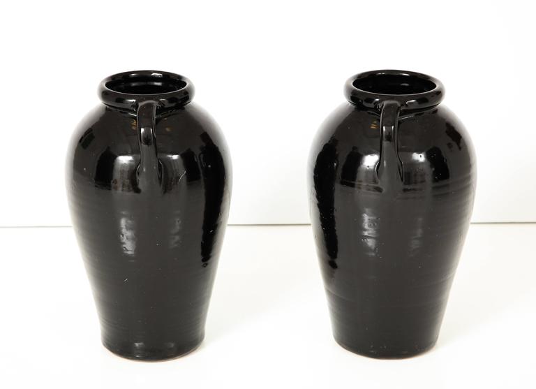 Pair of Tall Black Glazed Stone Ware Vases or Jars with Handles For Sale at 1stdibs