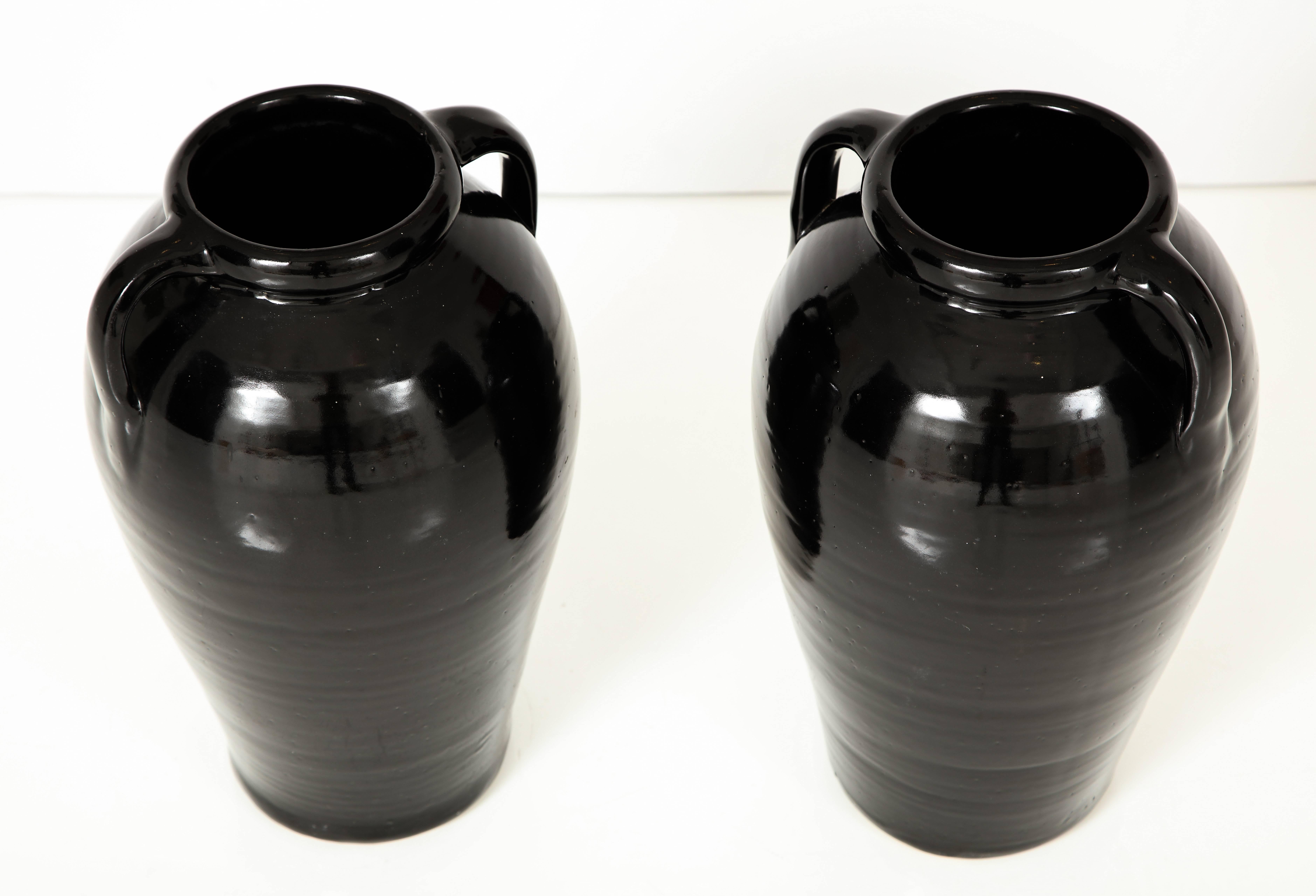 American Pair of Black Glazed Stone Ware Vases or Jars with Handles