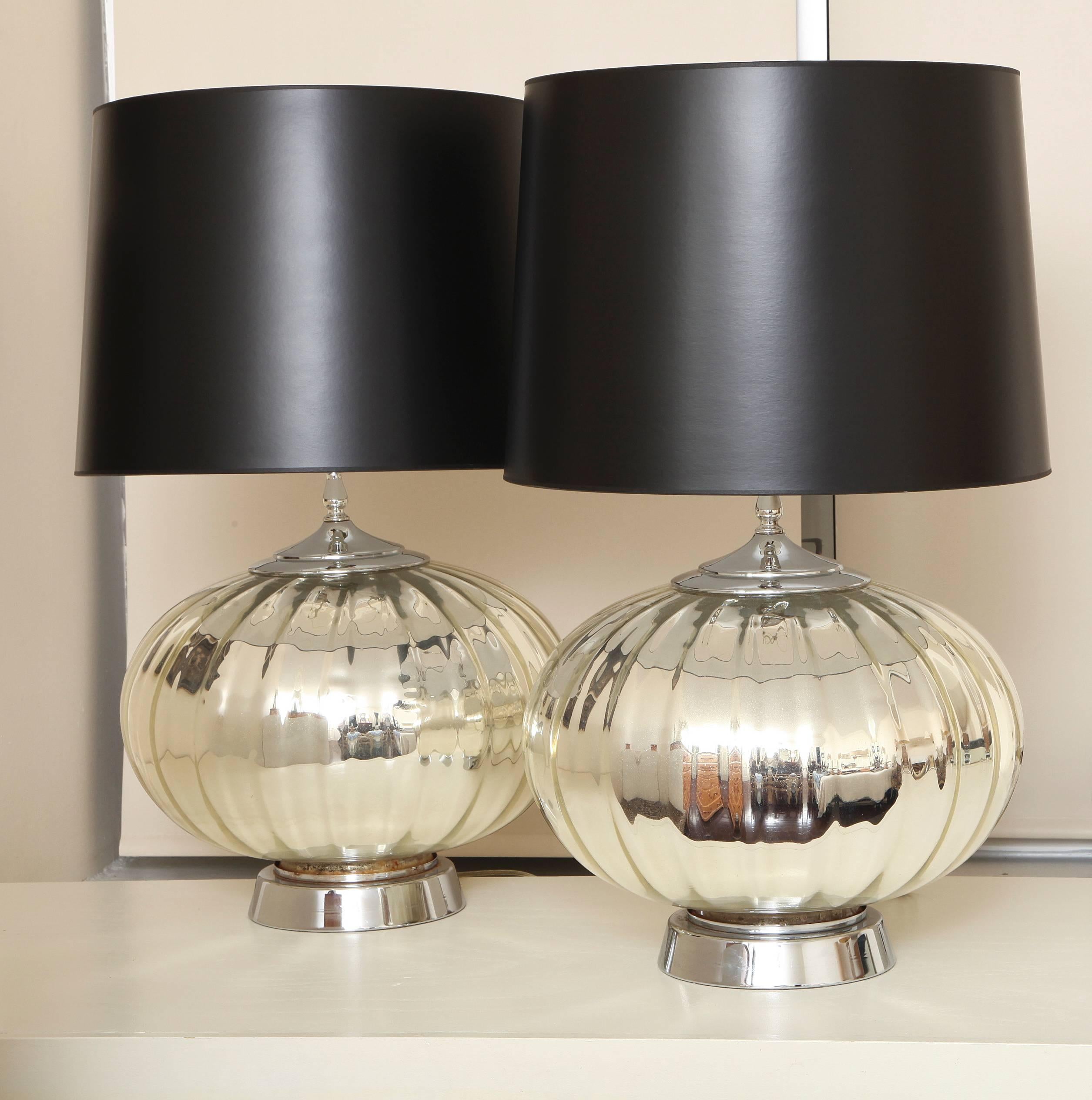 A grand scale pair of midcentury modern ribbed mercury glass table lamps; includes black paper shades if desired.