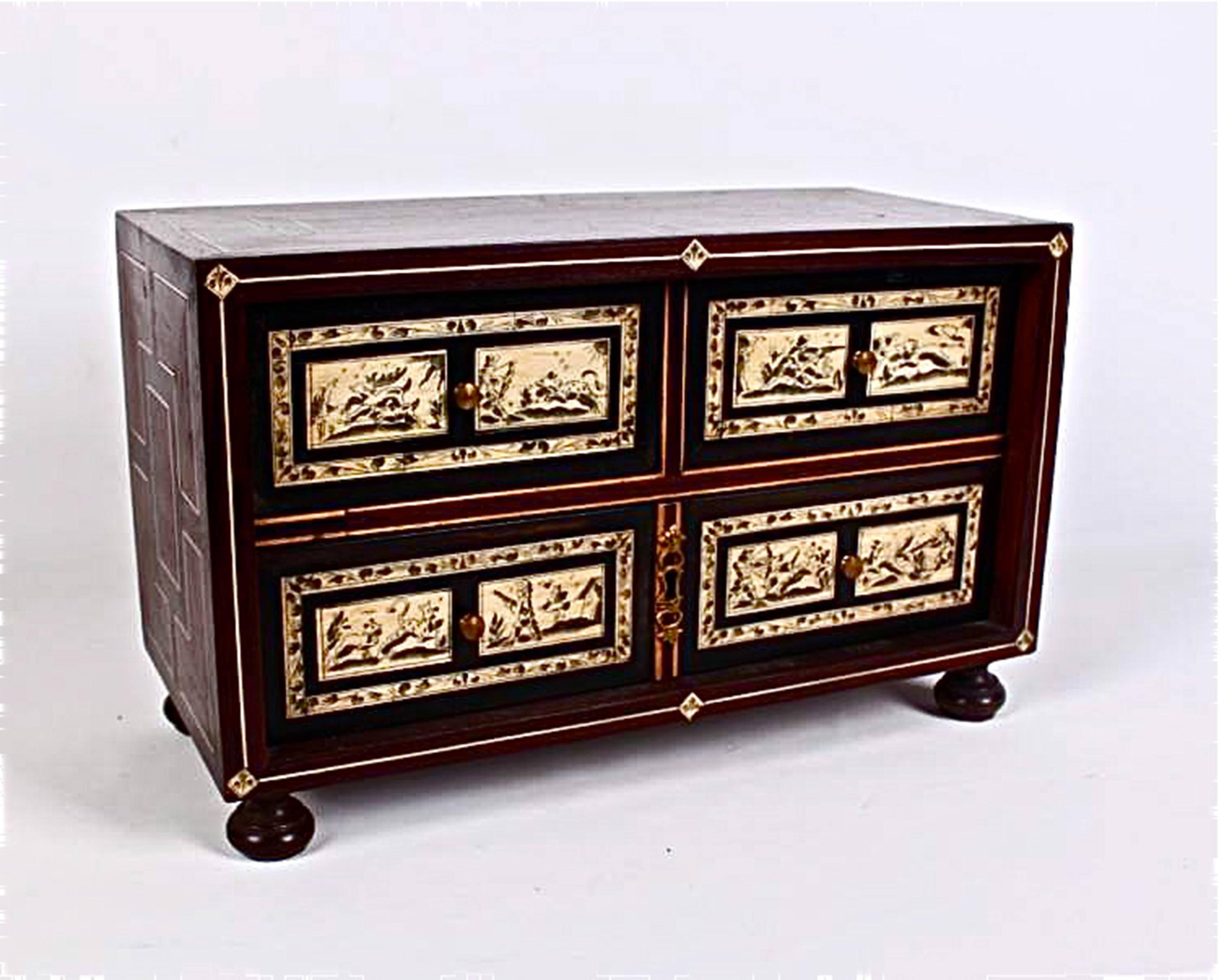 A late 19th century or early 20th century Neapolitan parquetry table cabinet in rosewood, mahogany, walnut and bone. The cabinet with three drawers, one large on the base and two small drawers on the upper tier.  The bone plaques incised with