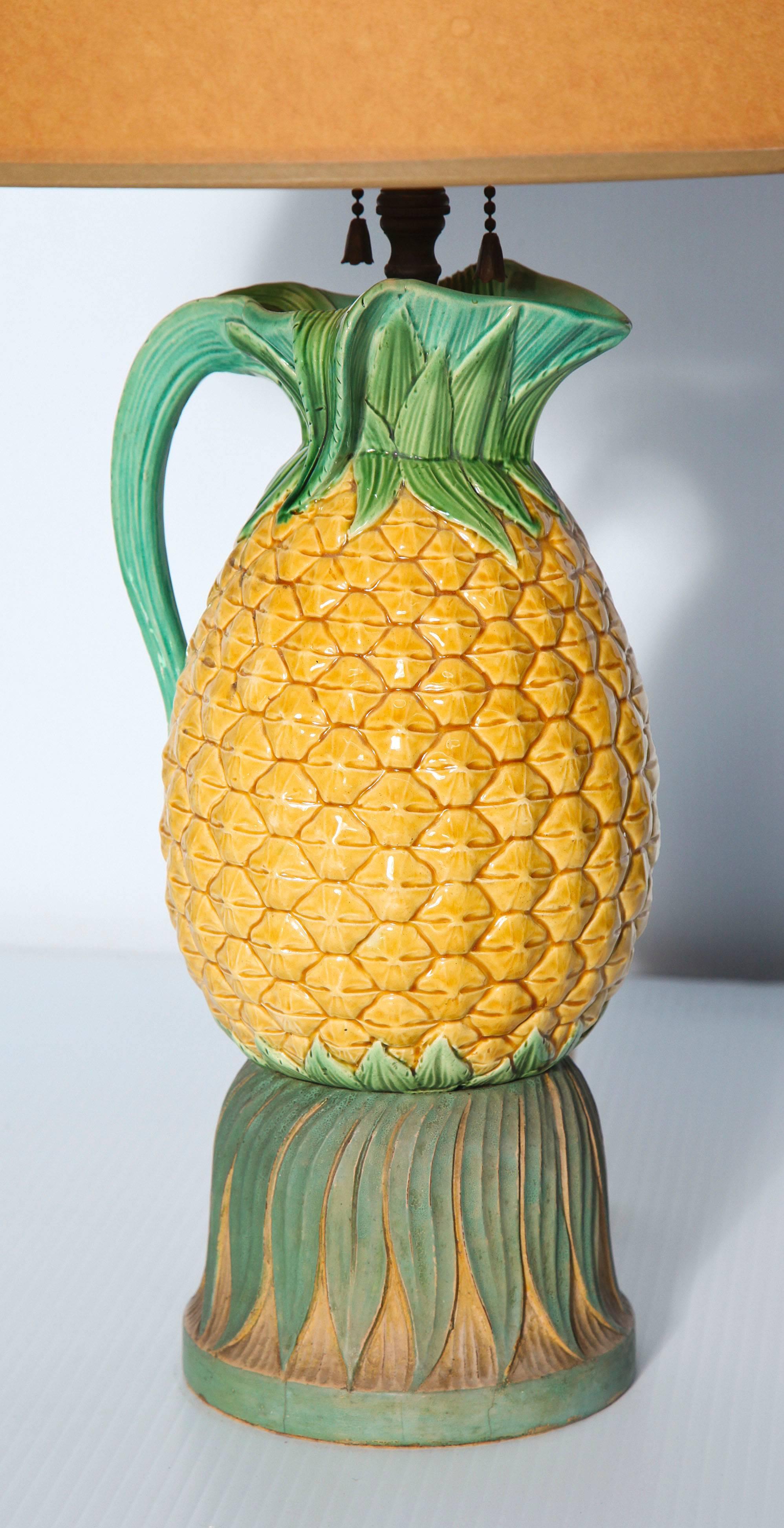 Late 19th century Italian Majolica pineapple pitcher mounted as a lamp with carved and painted foliate base.