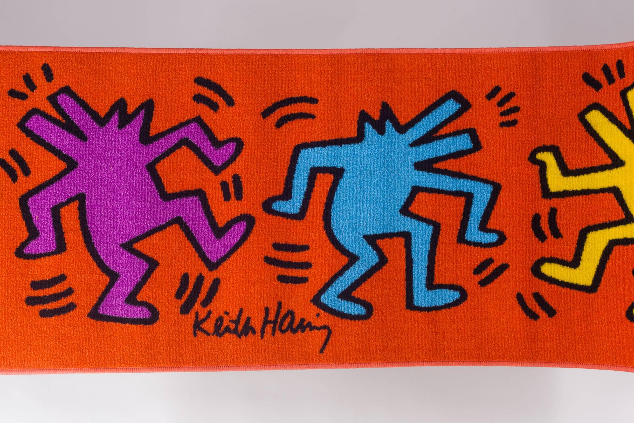 Brilliant colors in this Keith Haring runner with dancing figures, distributed by Comart Italia. Copyright Keith Haring Foundation, licensed by Artestar, New York. New old stock in packaging. Perfect addition to the home of anyone who admires the