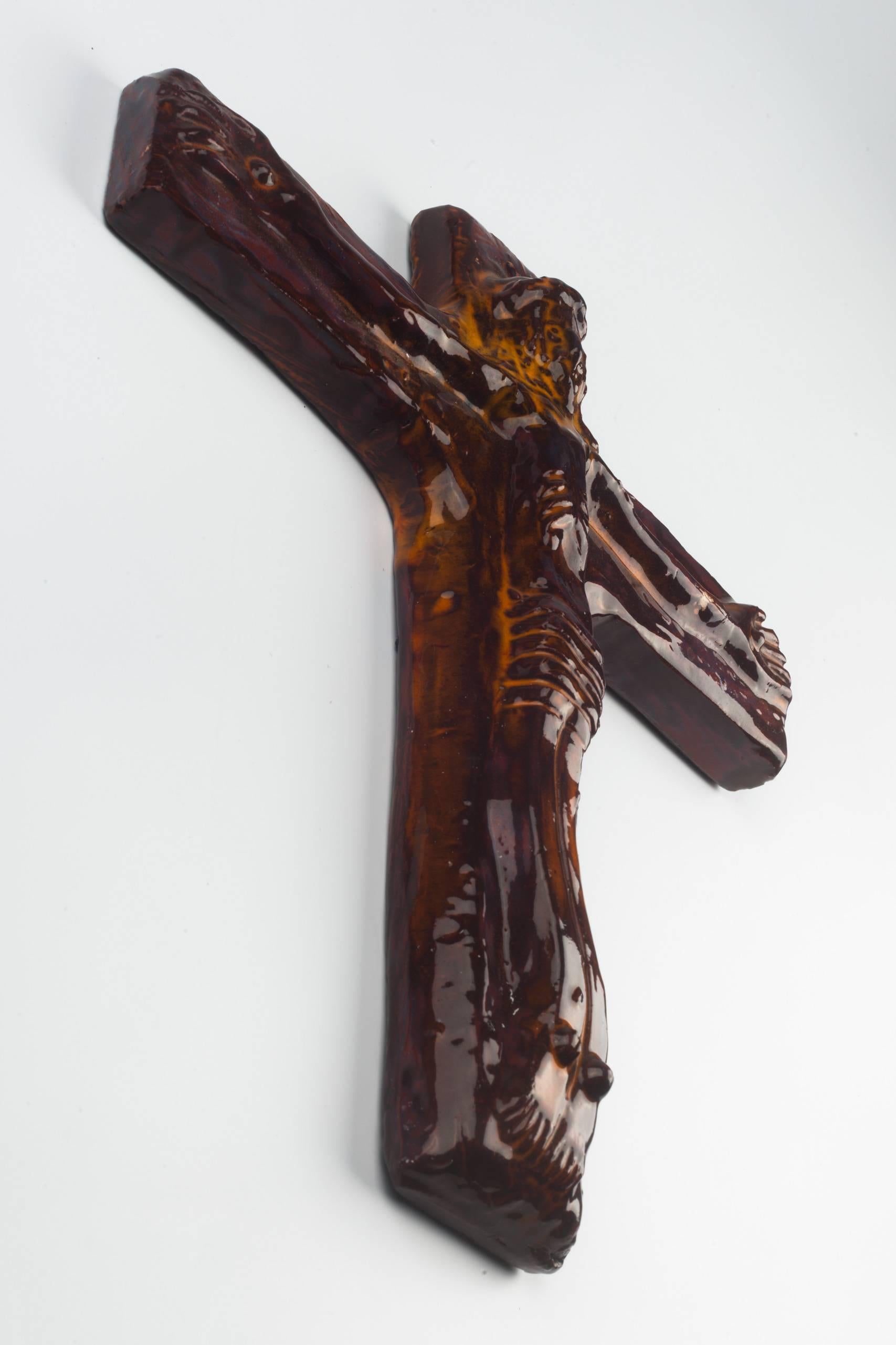 Eleven inch tall crucifix in ceramic, made in Belgium in the 1960s.
Glossy dark brown with yellow accents.

This piece is part of a 69 piece ceramic crucifix collection, all made in Belgium between the 1950 and late 1970s. From modernism to