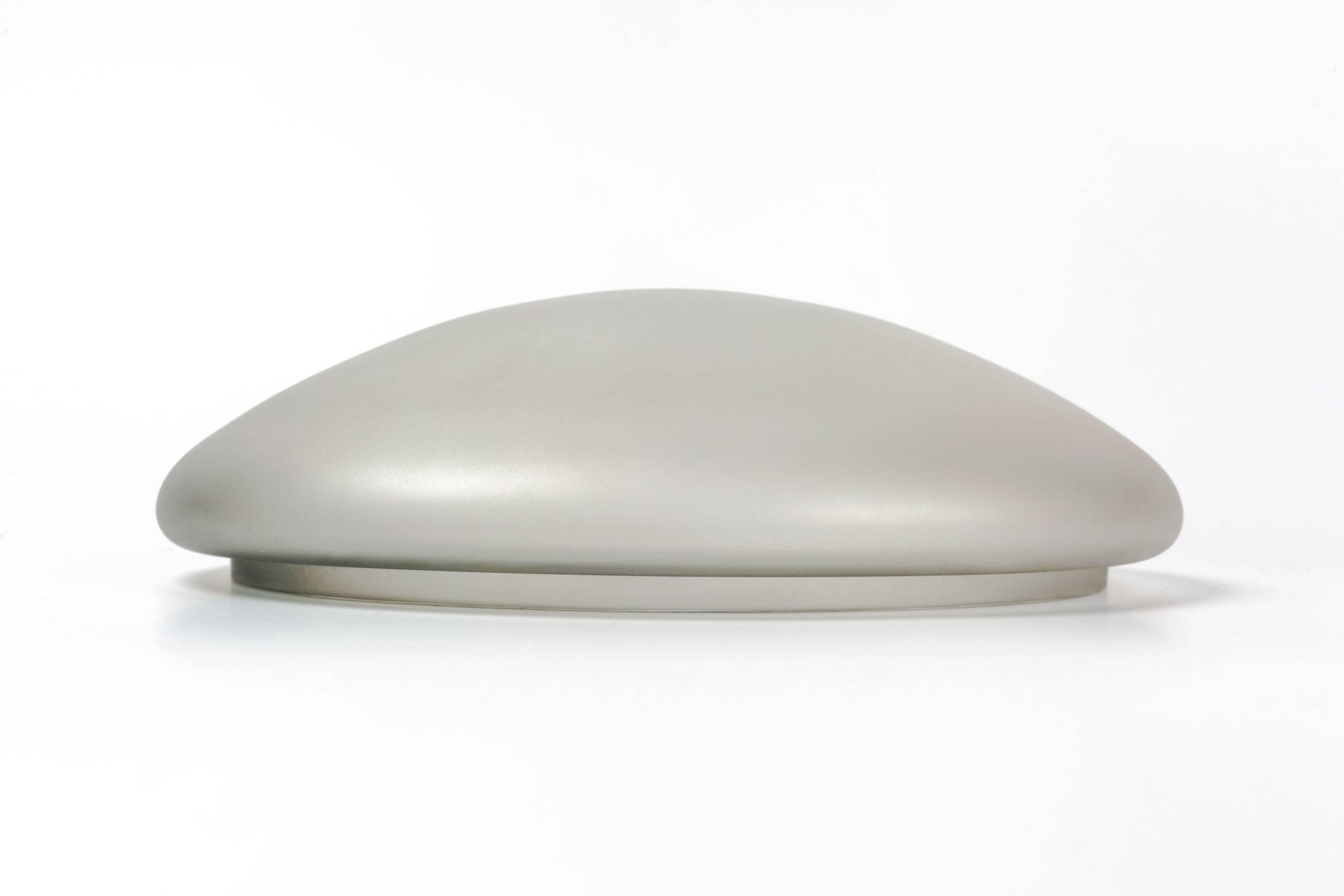 Large Murano glass box by Cenedese. Hand blown art glass in the Scavo technique, which combined with the neutral brown speckled coloration on the bottom gives it very lunar surface. Astonishing conductor of light, translucent and slightly