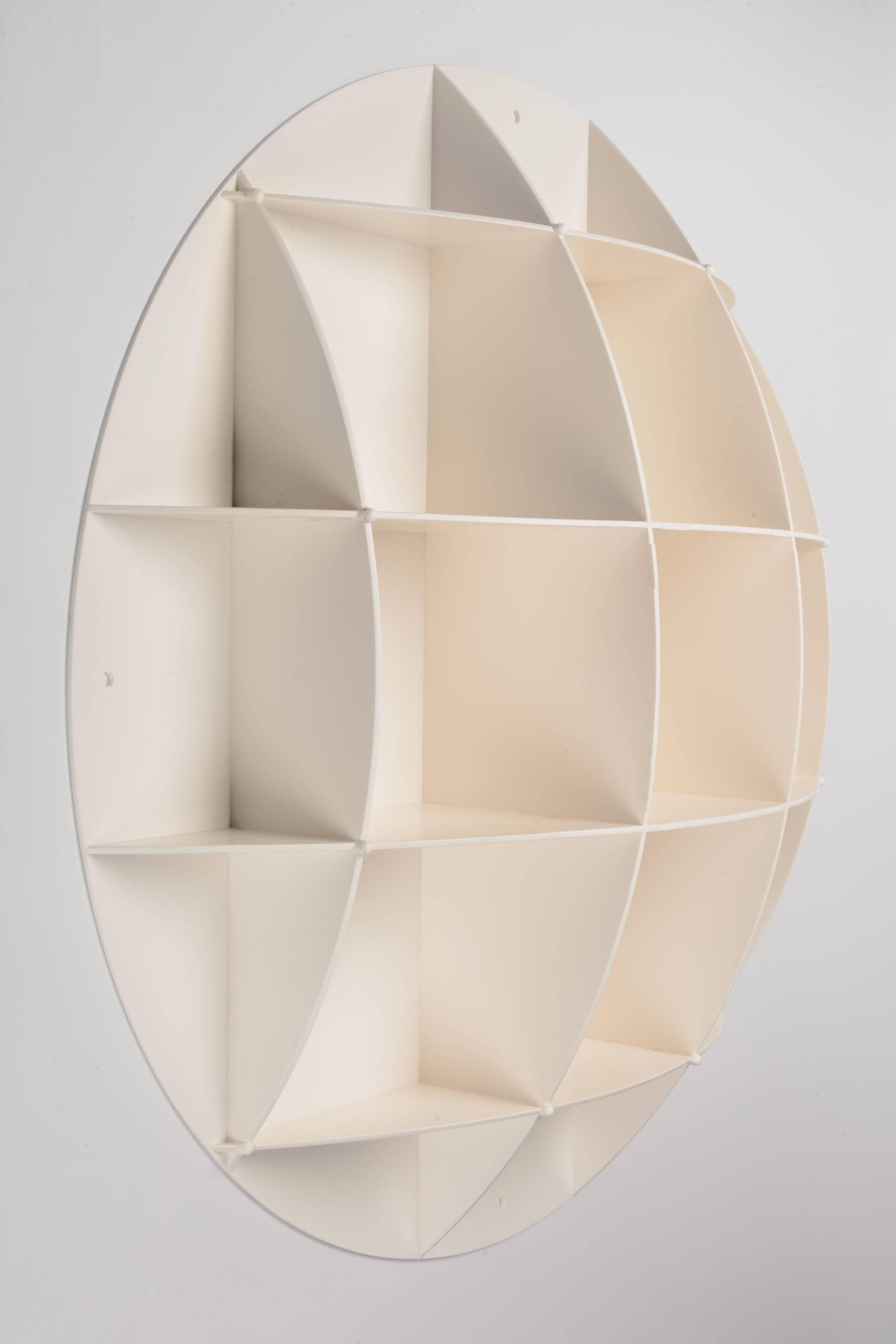 Round shelving unit with half sphere shape. Reminiscent of Joe Columbo's design. Makes the perfect pair of bedside wall shelves or medicine cabinets. Can be used empty as a wall decoration or filled to showcase collections of small objects. Limited