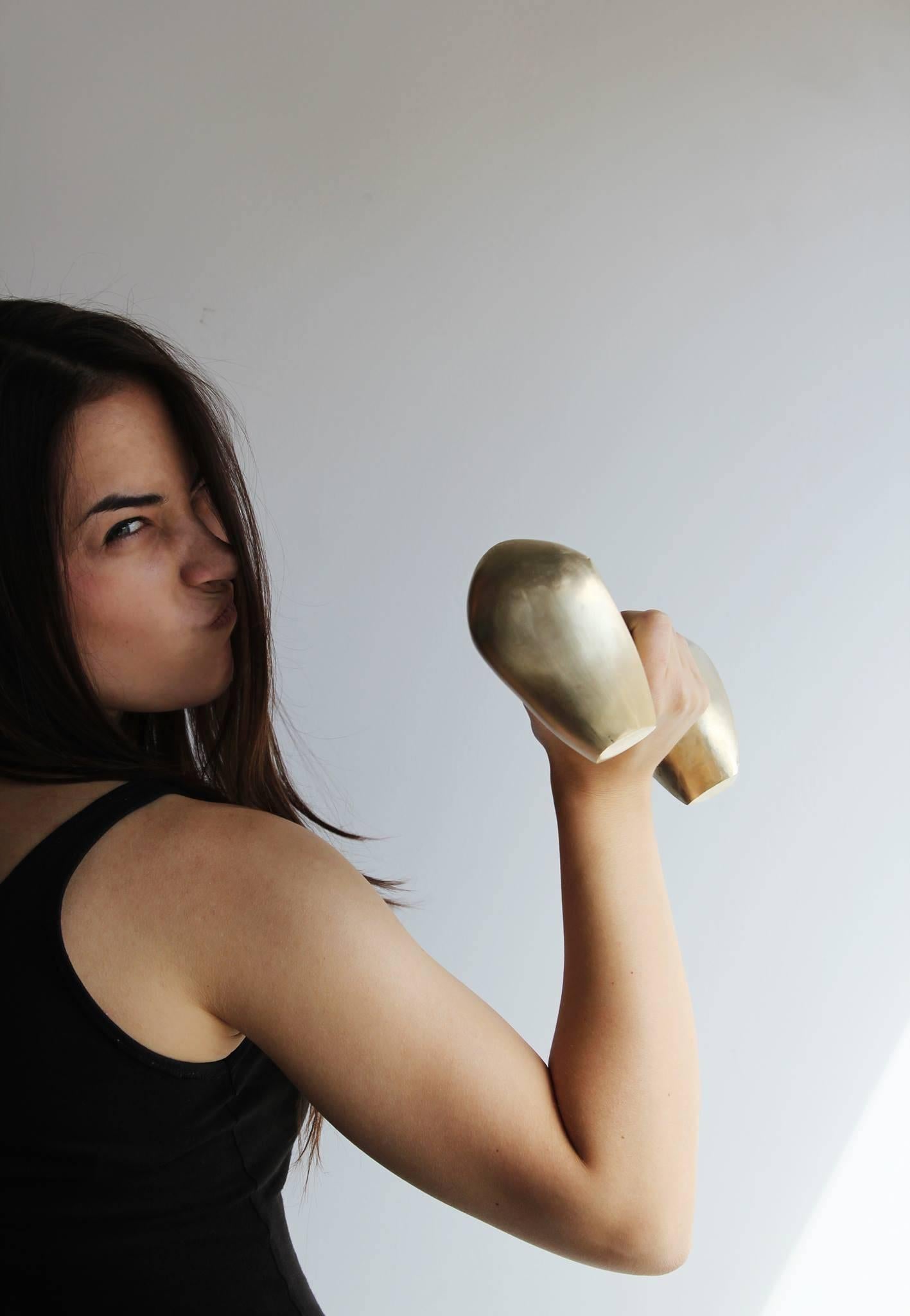 Brass free weights designed by Agnieszka Krzyżanowska for Éditions Philolux. 
Workouts are re-imagined with this pair of weights in solid brass, 3 kilos / 6.6 pounds each. An essential accessory that brings sculpture to strength building, the set