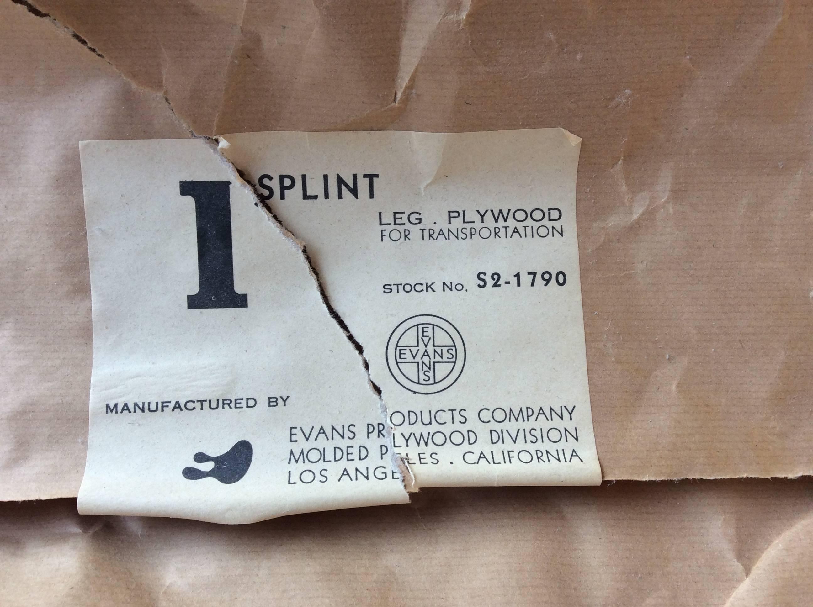 Rare Eames plywood leg splint from Evans Products Company, in original wrapper with label, circa 1943. Label and wrapper are torn.