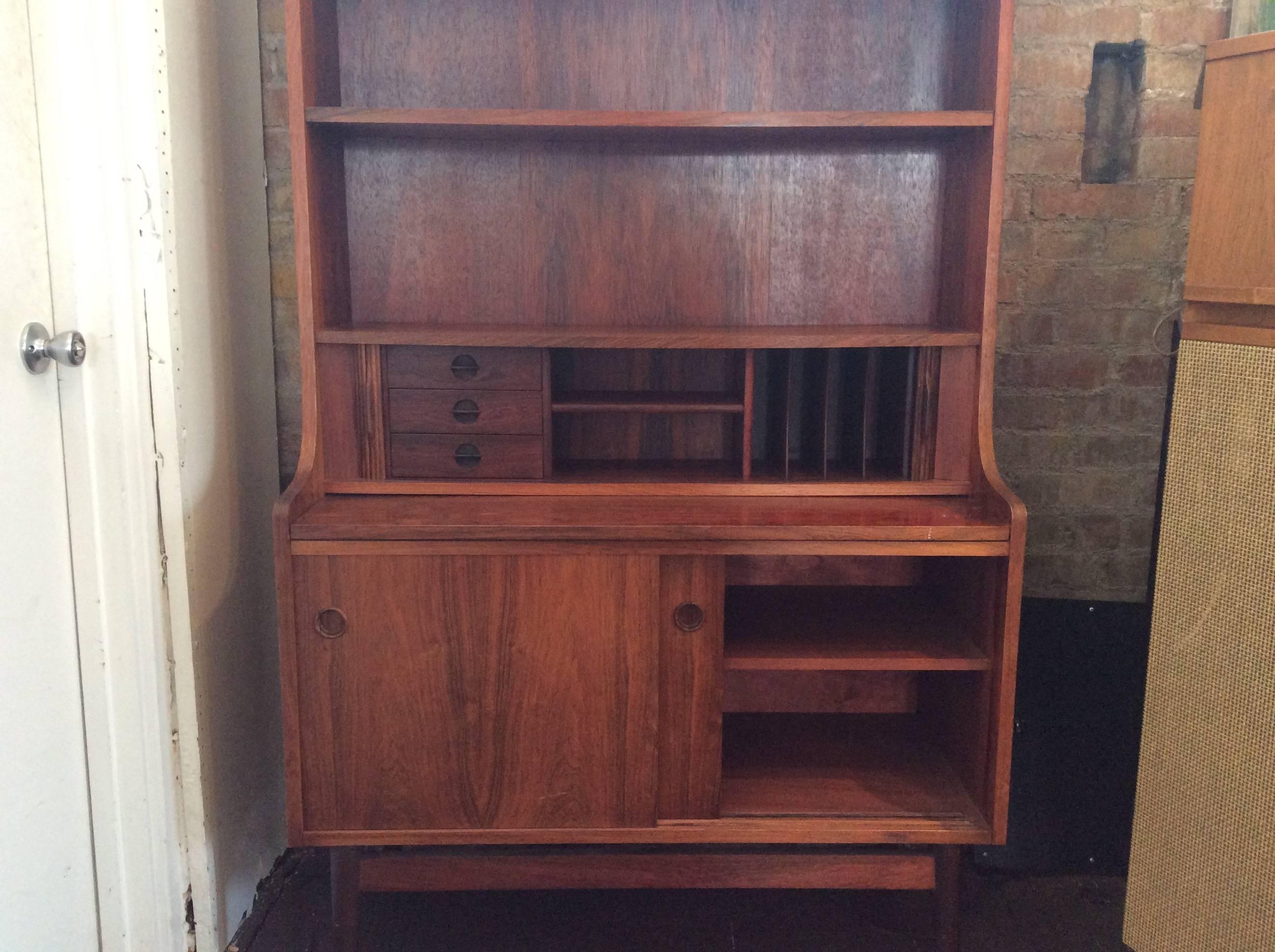 Gorgeous rosewood secretary with tambour doors and a slide-out desk, designed by Børge Mogensen. Made in Denmark.