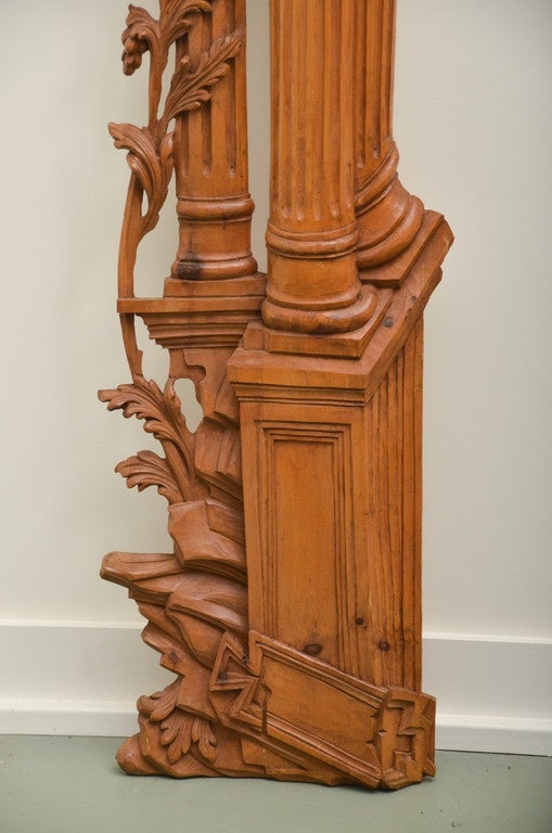 Carved olivewood door surrounds from Italy. Fluted columns and scrolled foliate design. Stylized Corinthian capitals.
