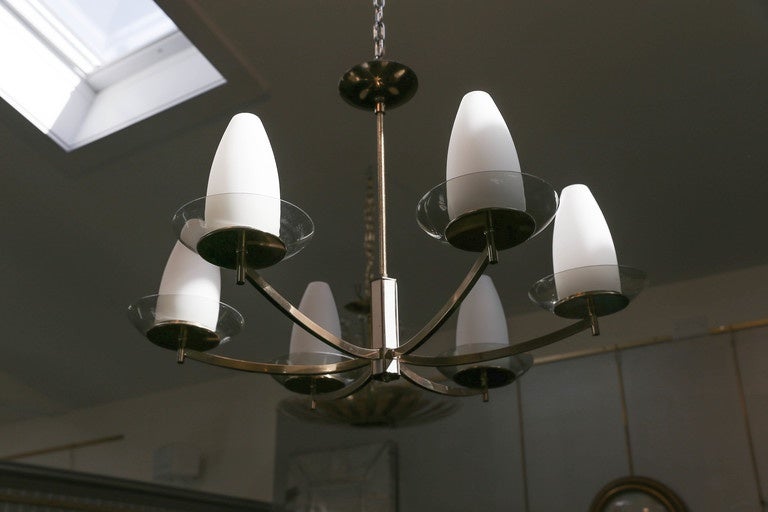 Very unusual Mid-Century Modern chandelier in the manner of Stilnovo consisting of brass, smoky glass plates and opaline glass shades.
