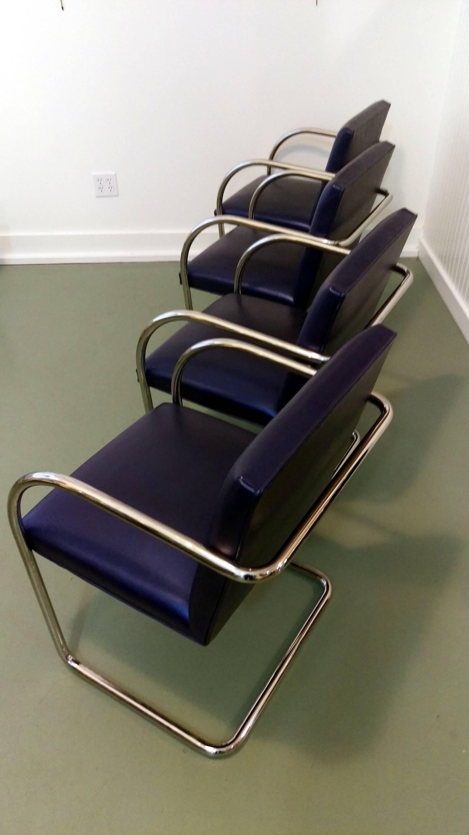 Set of four renowned Brno chairs by Brueton, this modern timeless architectural form is supported by a cantilevered stainless steel tube. It has a clean line profile and is surprisingly comfortable. These have original Brueton's exclusive and