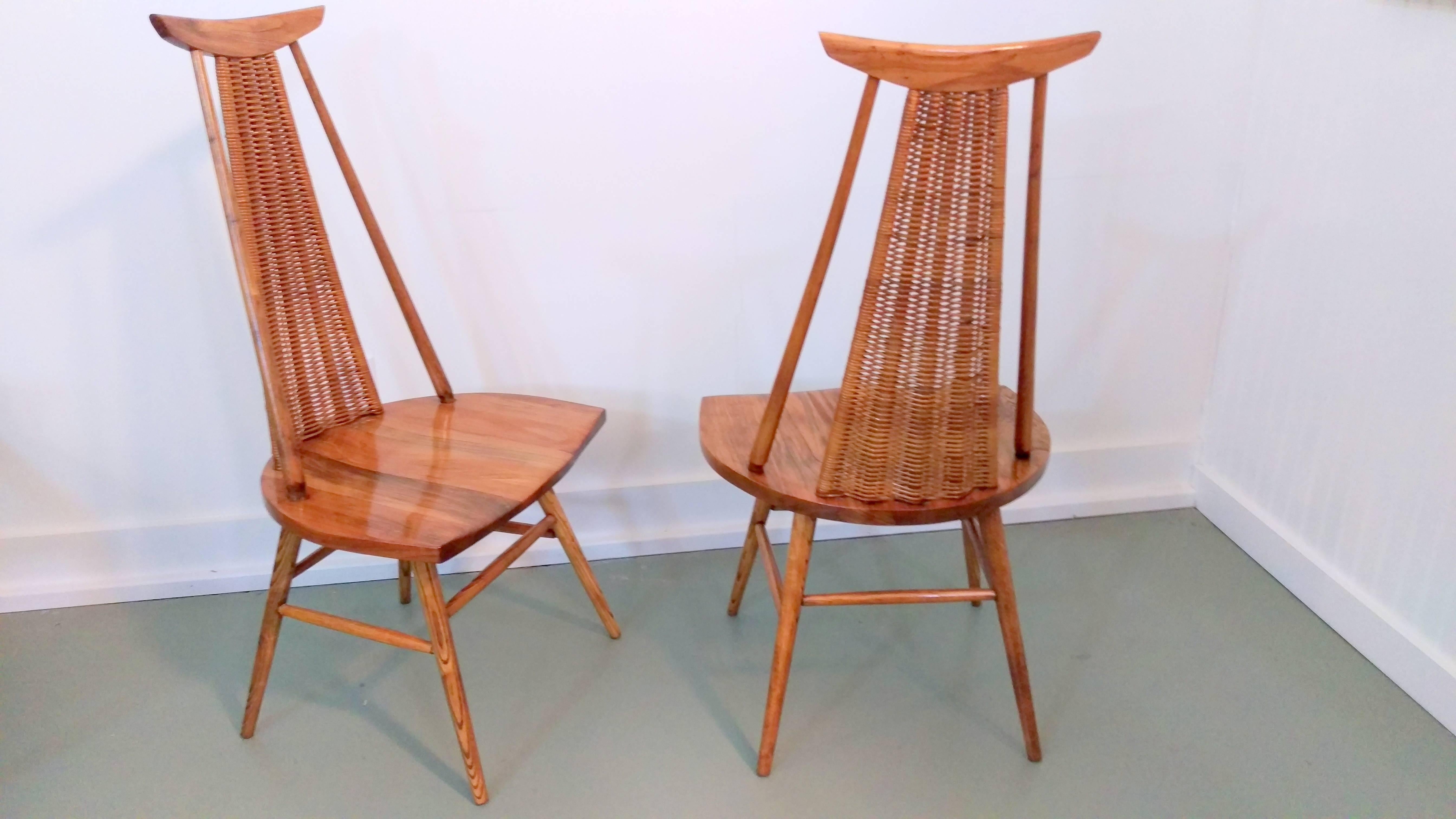 Extremely rare and exquisite pair of easy chairs by Finnish Architect Ilmari Tapiovaara. The chairs are fine example of Tapiovaara known to combine modern design aesthetic and Finnish peasant tradition. The use of solid wood added to the aura of