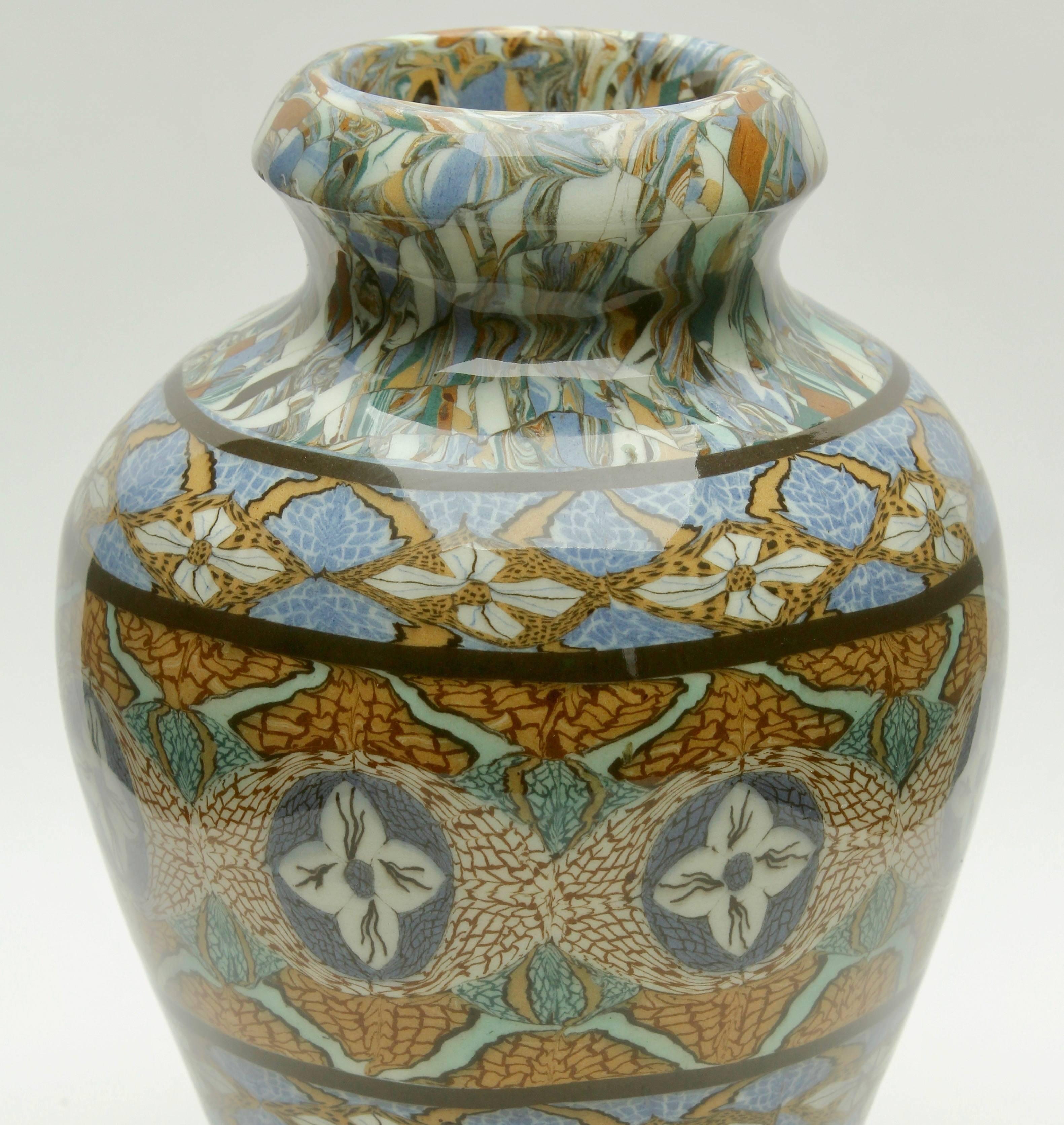 French Vallauris clay mosaic vase by Ceramicist Jean Gerbino

Vase are made from various colored clays with beautiful mosaic patterning.
Signed on the bottom Vallauris
looks simply stunning.

The piece is in excellent condition and a real
