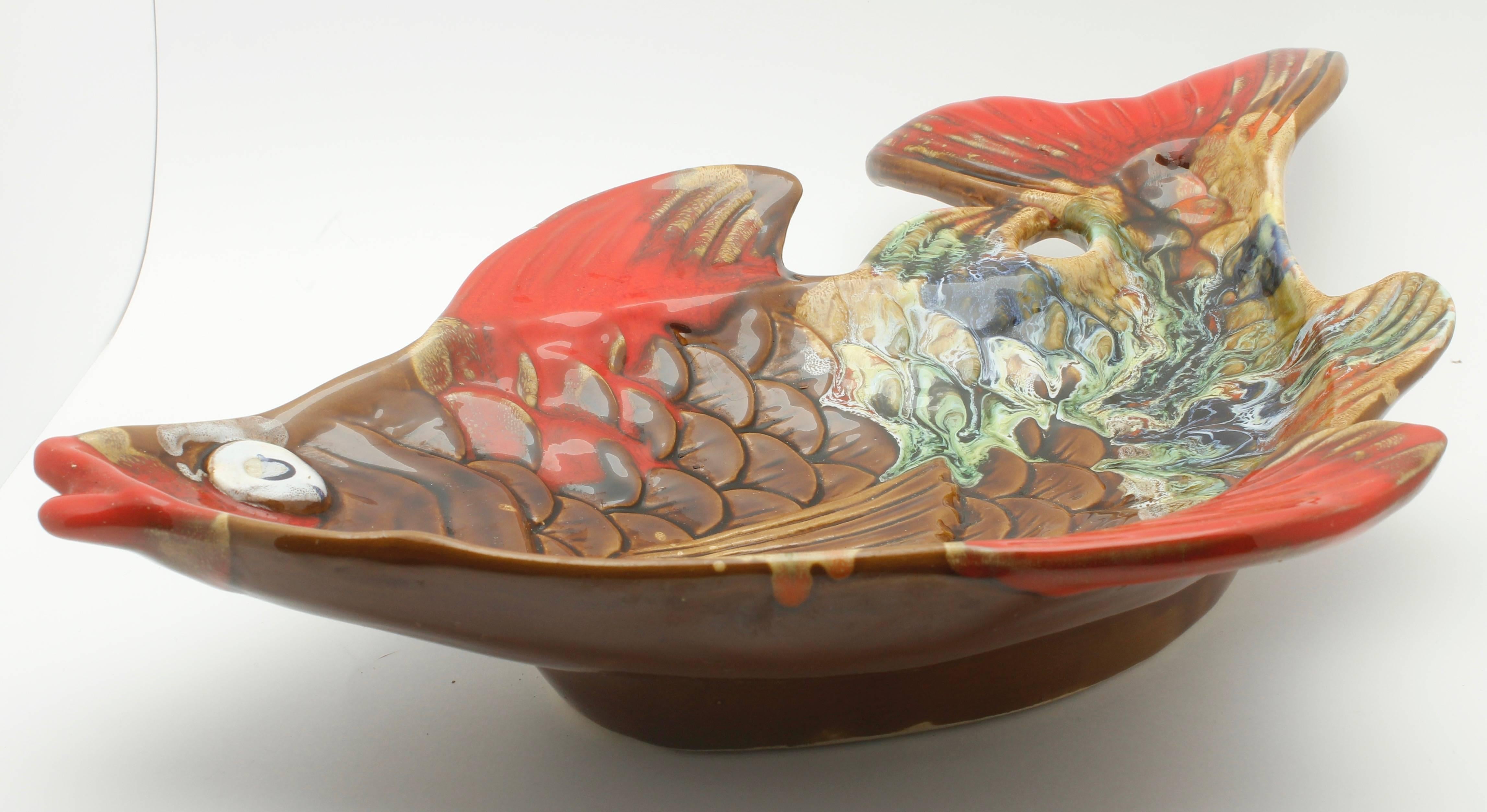 Vallauris (France) pottery ceramic, red and brown and green in color fish shape plate.

The piece is in excellent condition and a real beauty!


