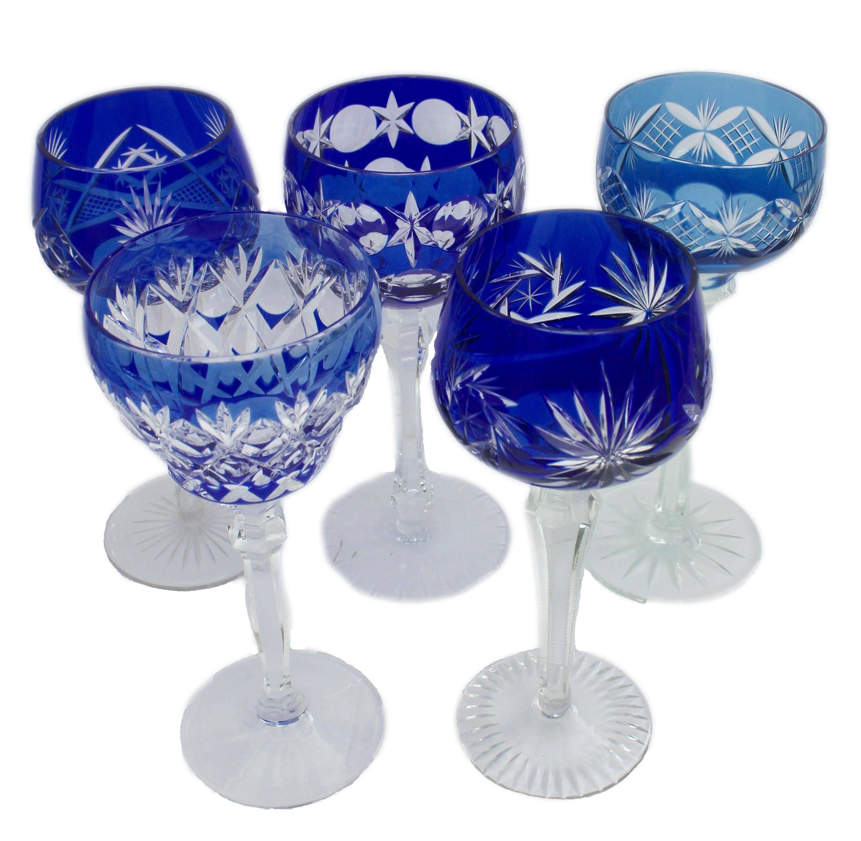 Overlay stemmed glasses

Collection of 21 heavy cut crystal stemmed goblets.
Each is overlaid in colored and cut back to clear 
Made in Germany
Different sizes on average height 8 inch, width 3 inch

They are handblown and heavy cut lead crystal in