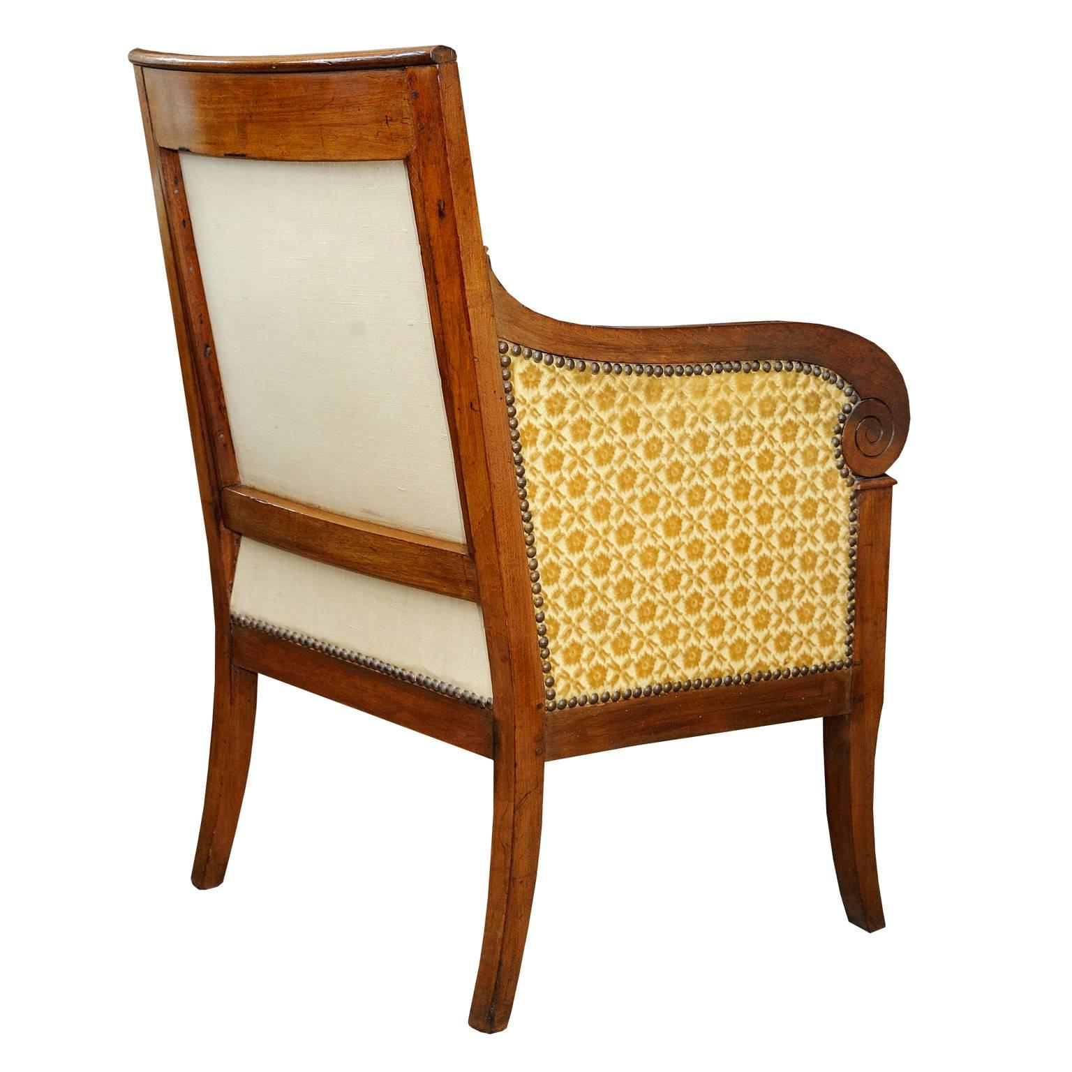 This is an elegant and very nicely proportioned French Empire mahogany bergere armchair with beautifully scrolled arms and detailed frontal carving,
circa 1820

