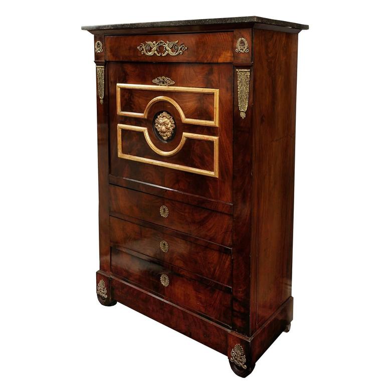 This is a very pretty French early 19th century Empire Napoleonic secretaire a abattant or fall front desk.

The interior features tooled leather with a fully drawered and mirrored back above and three drawers below, complete with a beautiful