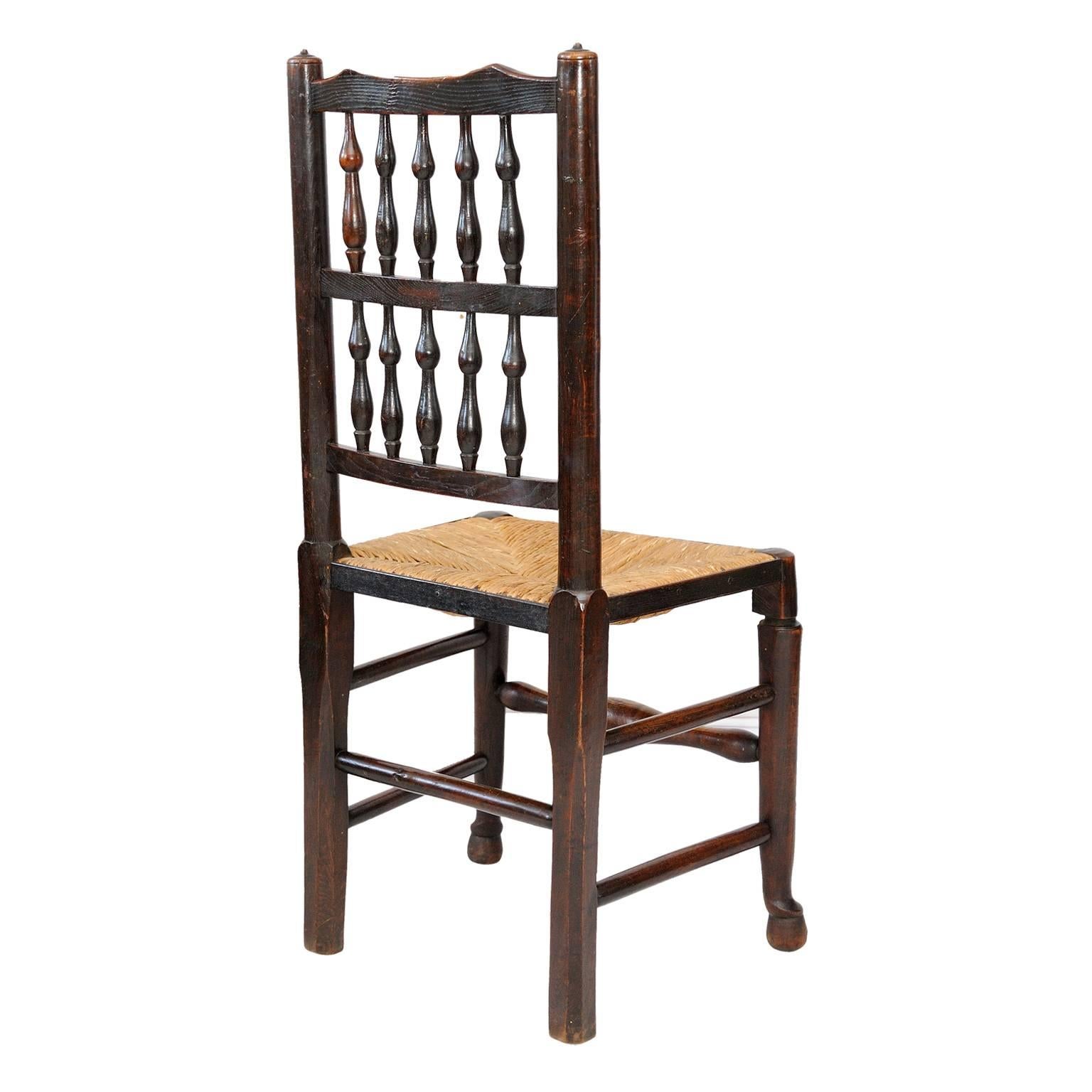 Polished A Harlequin set of 12 Georgian Oak and Elm Spindle Back Chairs, circa 1820 For Sale