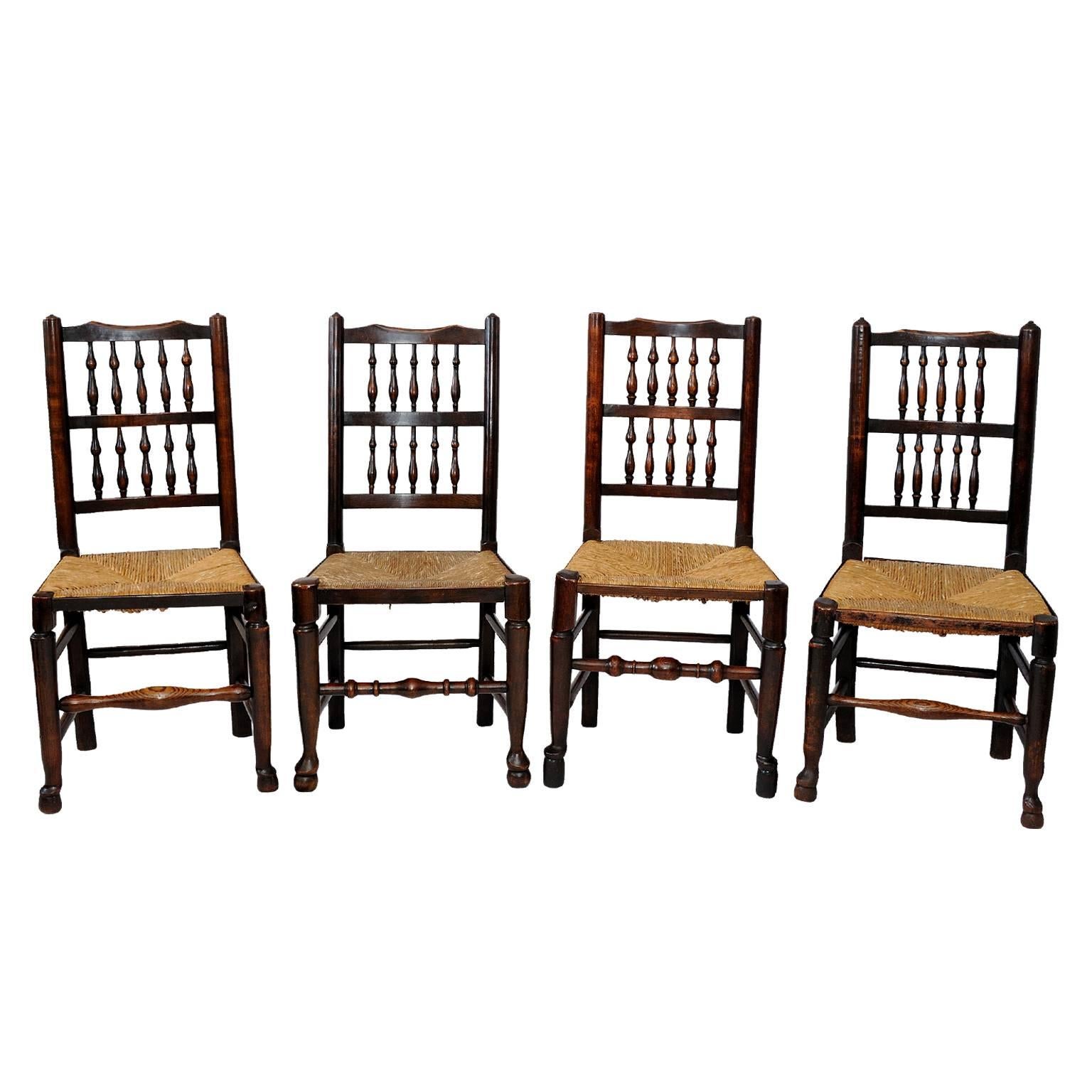 This is a superb and very useful harlequin set of 12 early 19th century Georgian oak and elm spindle back chairs with rush seats, circa 1820.

The four slightly different designs compliment each other beautifully. 
 