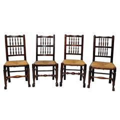 A Harlequin set of 12 Georgian Oak and Elm Spindle Back Chairs, circa 1820