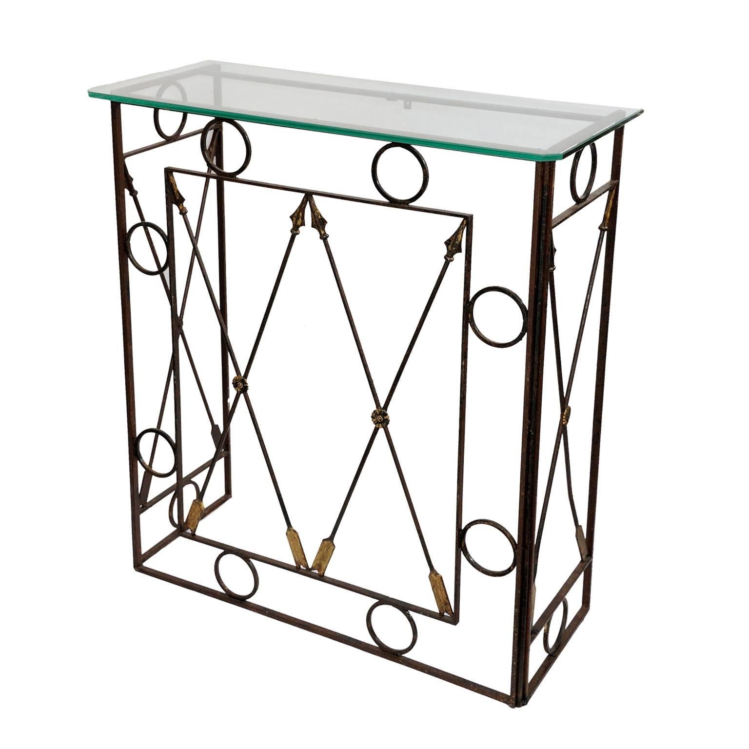 ​This is a superb and very stylish French iron console table with a glass plate top in the Napoleonic Empire style, featuring a wonderful arrow design, circa 1950.