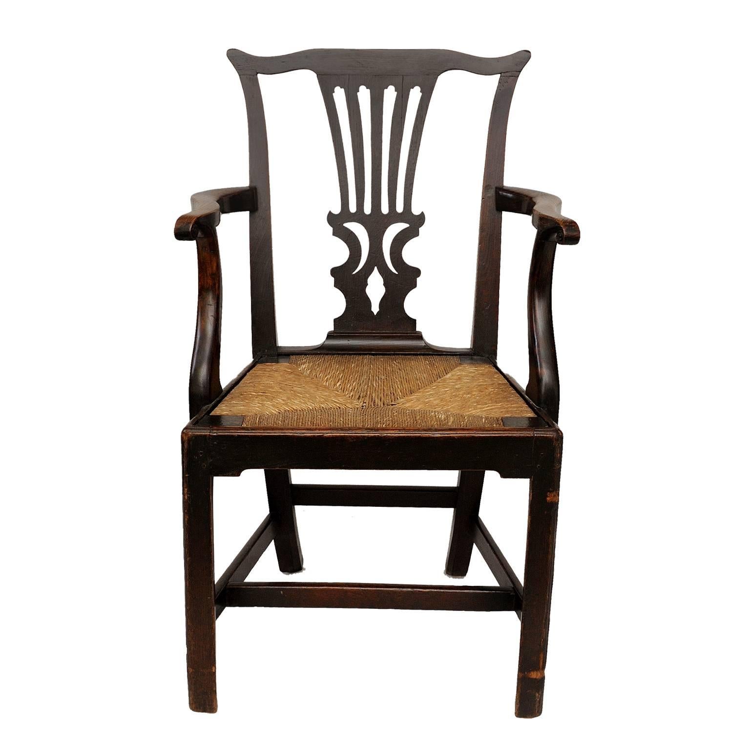 This really is a handsome English George III mid-18th century Country Chippendale open-arm or desk chair with a rush seat, a lovely example of its type, circa 1760.