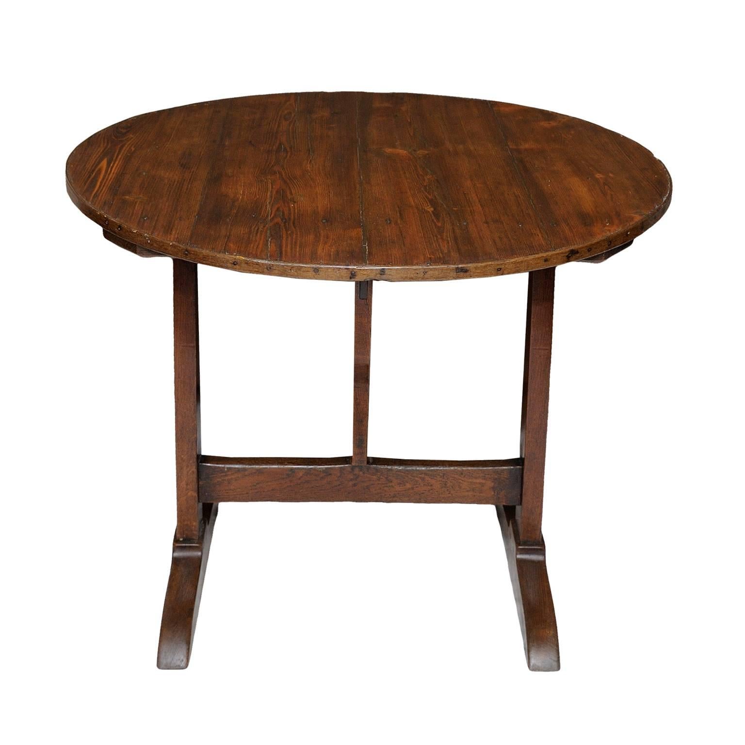 This is a rather charming and extremely useful mid-19th century French wine tasting table.
Constructed in pine and oak, the table has a wish bone tipping action, that allows this rather pretty table to be folded into a very compact size, circa