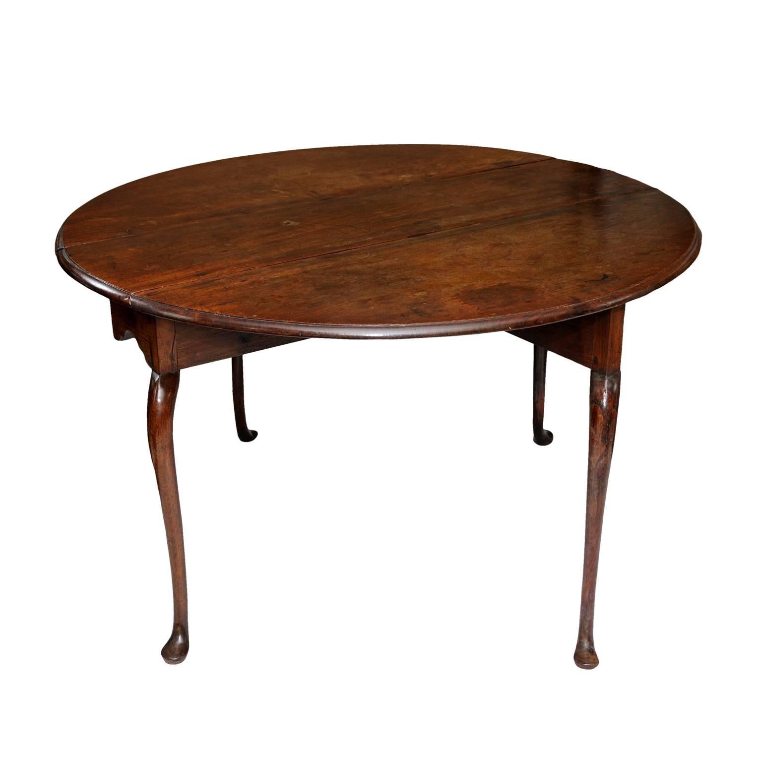 This is a beautiful and rare 18th century Anglo Dutch East Indies Padauk wood drop leaf table. This well proportioned table folds down to a very useful and slim size, circa 1760.