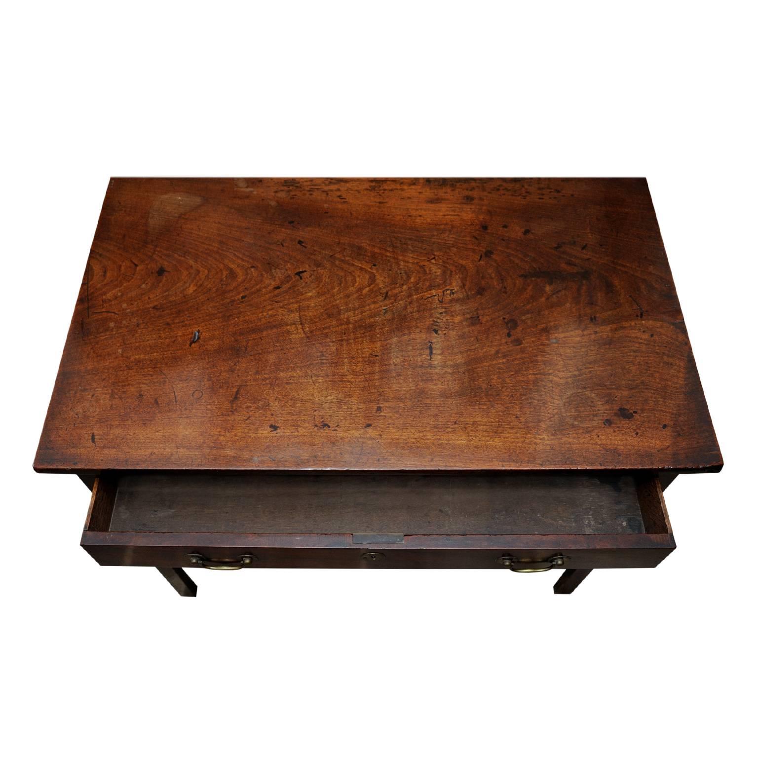 This is a very good, large English George III mahogany mid-18th century Chippendale period side or writing table displaying a lovely colour and offering very usable proportions. This piece retains its original handles, escutcheons and lock, circa