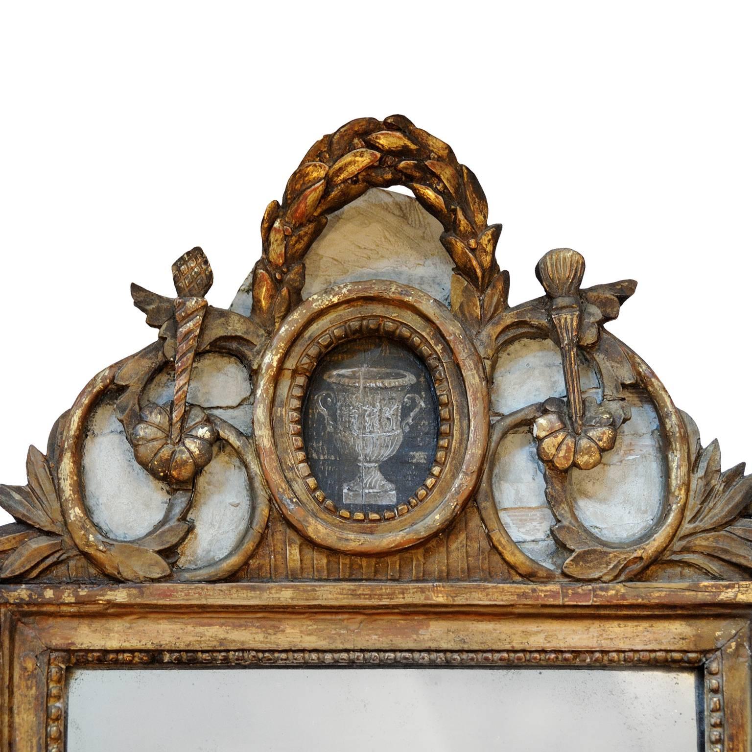 This is a highly charismatic and beautiful late 18th century French Louis XVI period painted and gilt mirror, featuring its original mirror plate complete with lovely foxing, circa 1780.