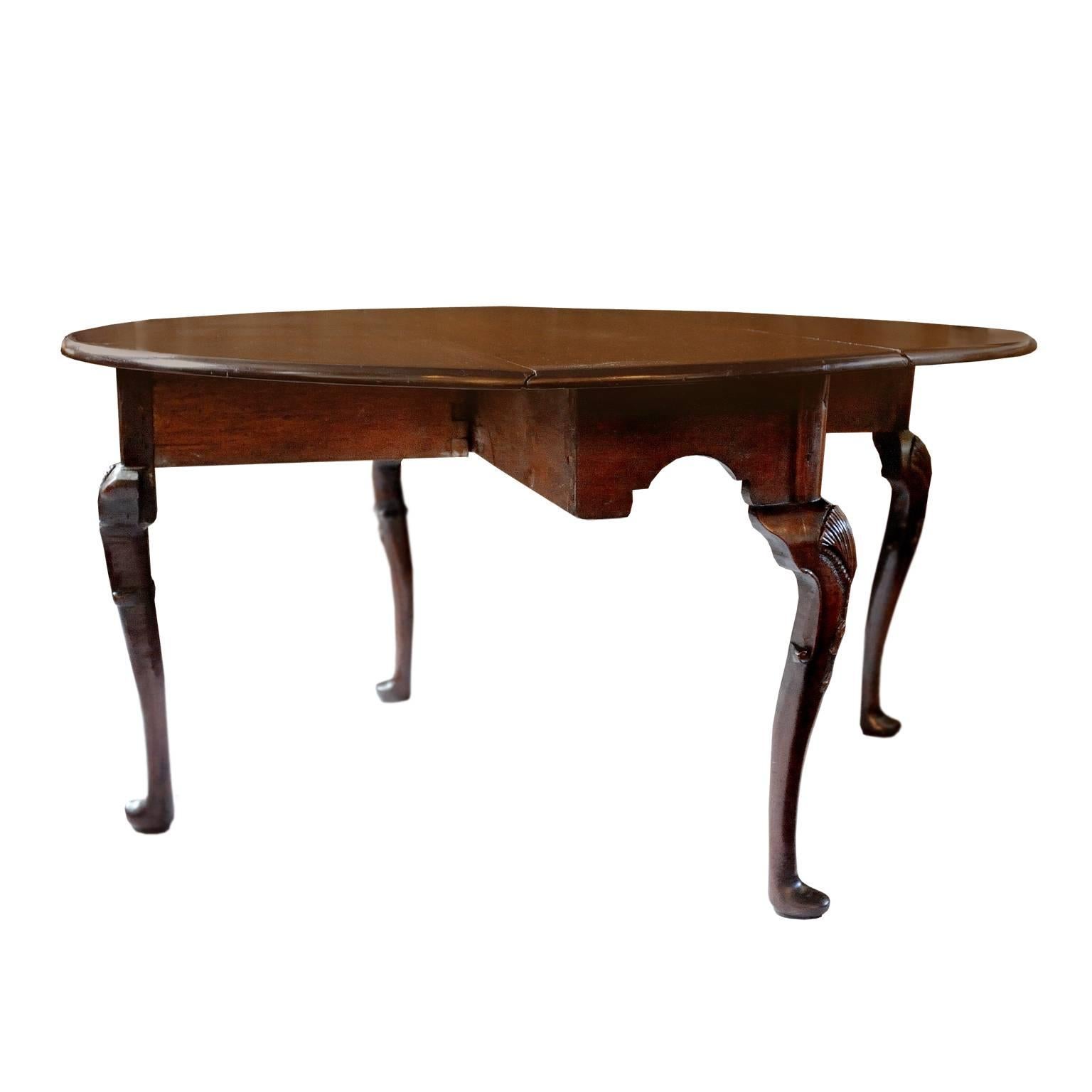 This is an absolutely beautiful example of an Irish George III mid 18th Century Cuban mahogany Drop Leaf Table, with very good cabriole legs, shell carvings to the knees and standing on pad feet, circa 1760. 