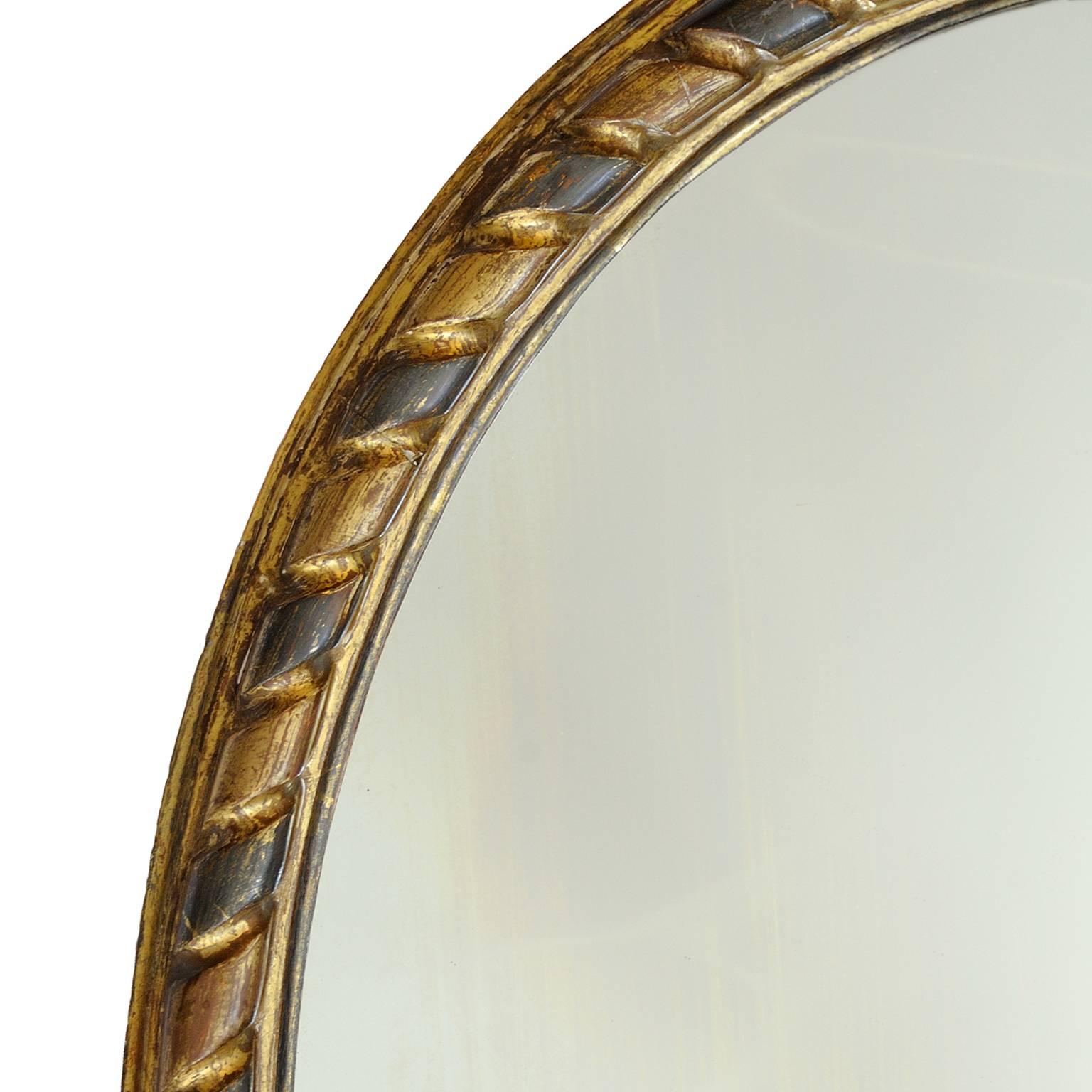 This is a lovely and very stylish Irish George III gold and silver leaf oval mirror, circa 1780.

A rather beautiful example of it's type.