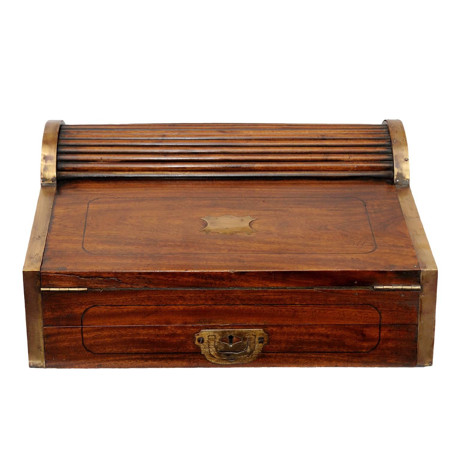 This is a lovely and early example of a 19th century Anglo Chinese camphor wood Writing Slope with automatic handle action, made for the European market, circa 1820. 

Examples of these can be seen in the Peabody Essex Museum at Salem and in the