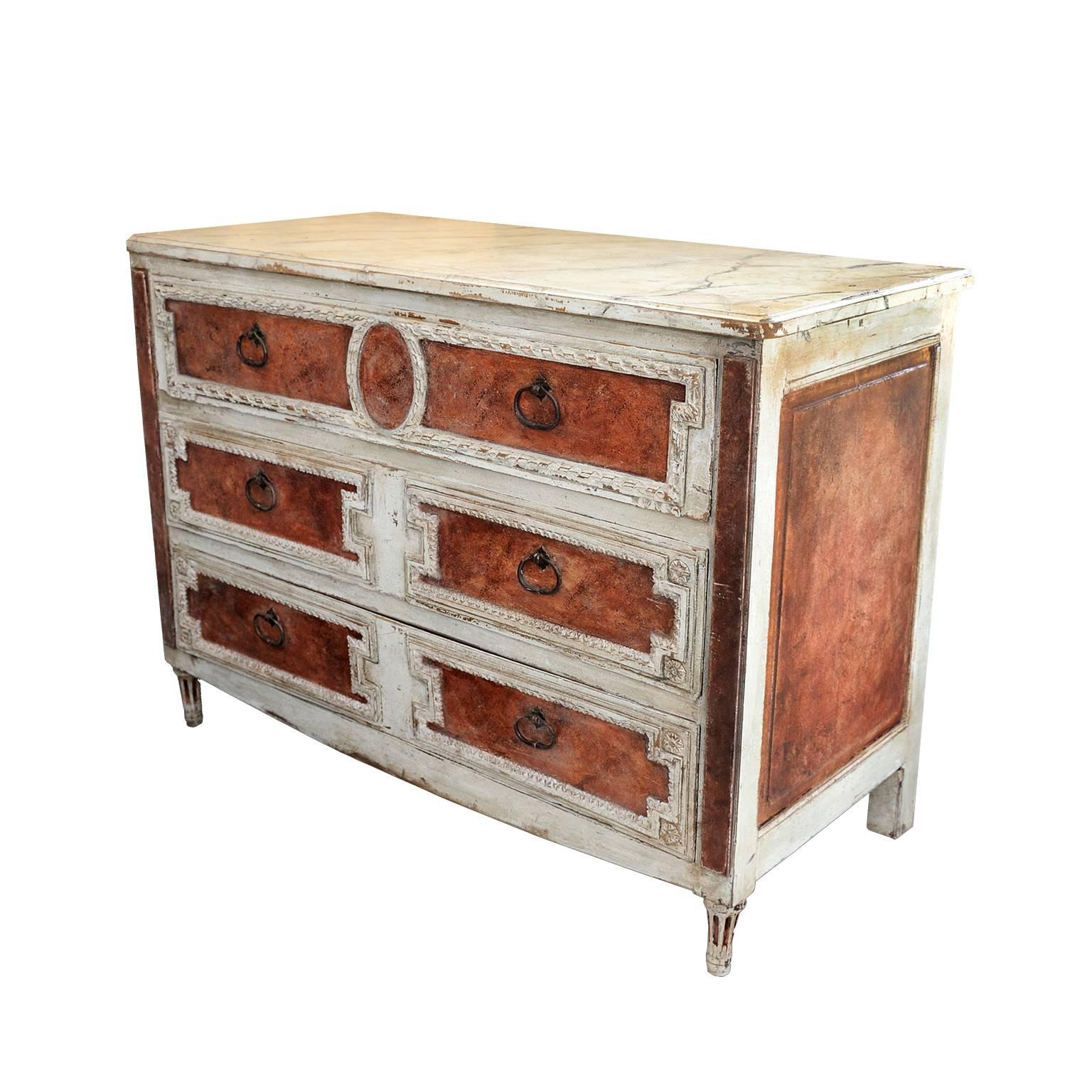 This is a superb late 18th century Italian neoclassical painted faux porphyry and Carrara marble Italian commode or chest of drawers. This piece has three well-proportioned drawers and has beautiful detailing to the drawer fronts and legs, circa