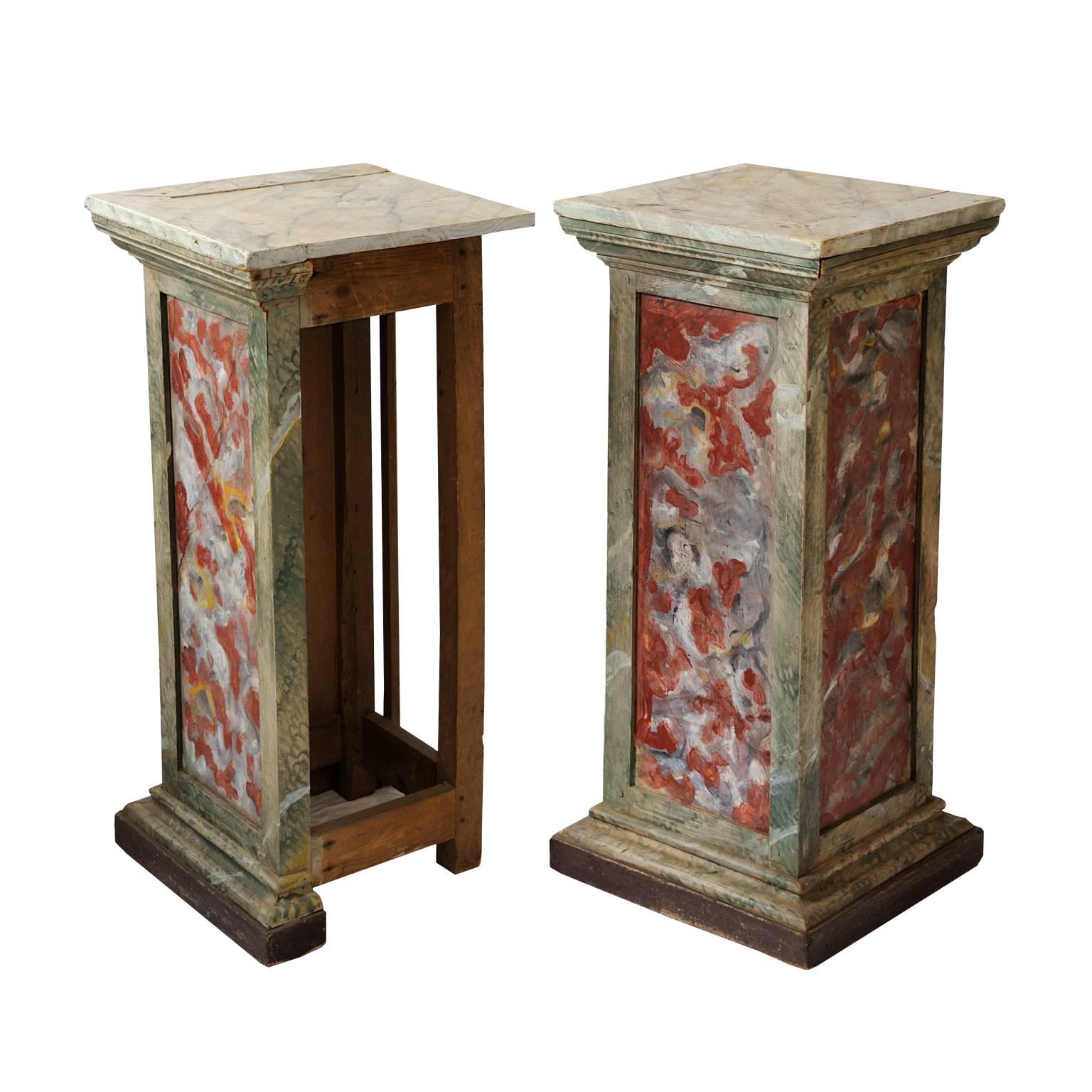 This is a wonderful pair of Italian Louis XVI faux painted marble corner pedestals or columns with open-framed backs, circa 1780.