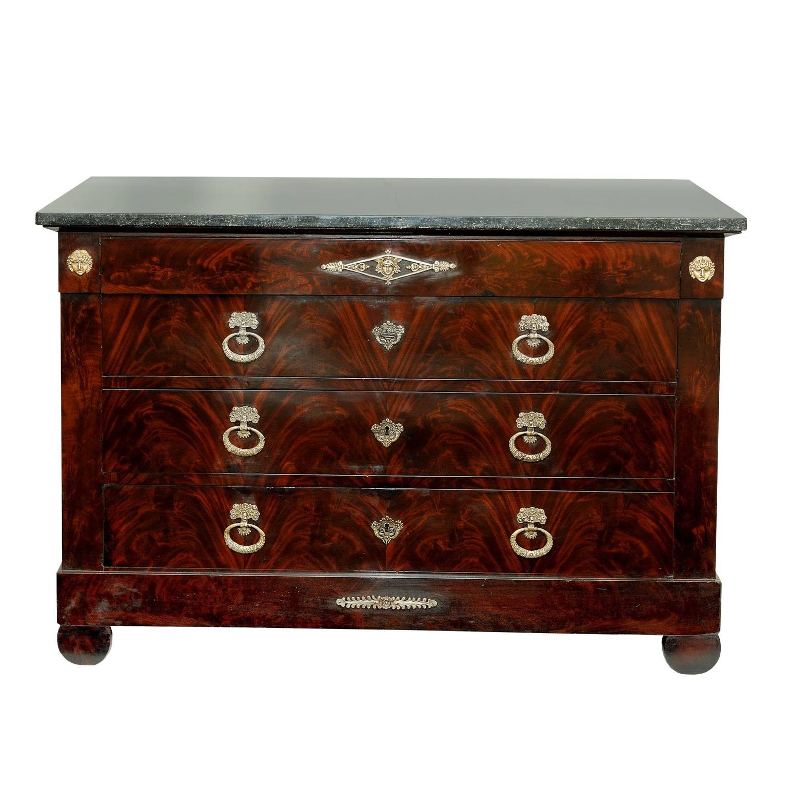 This is a wonderful French 19th century Napoleonic Empire period mahogany commode chest of drawers, displaying great color and complete with original marble top and beautiful brass handles and escutcheons, circa 1820.