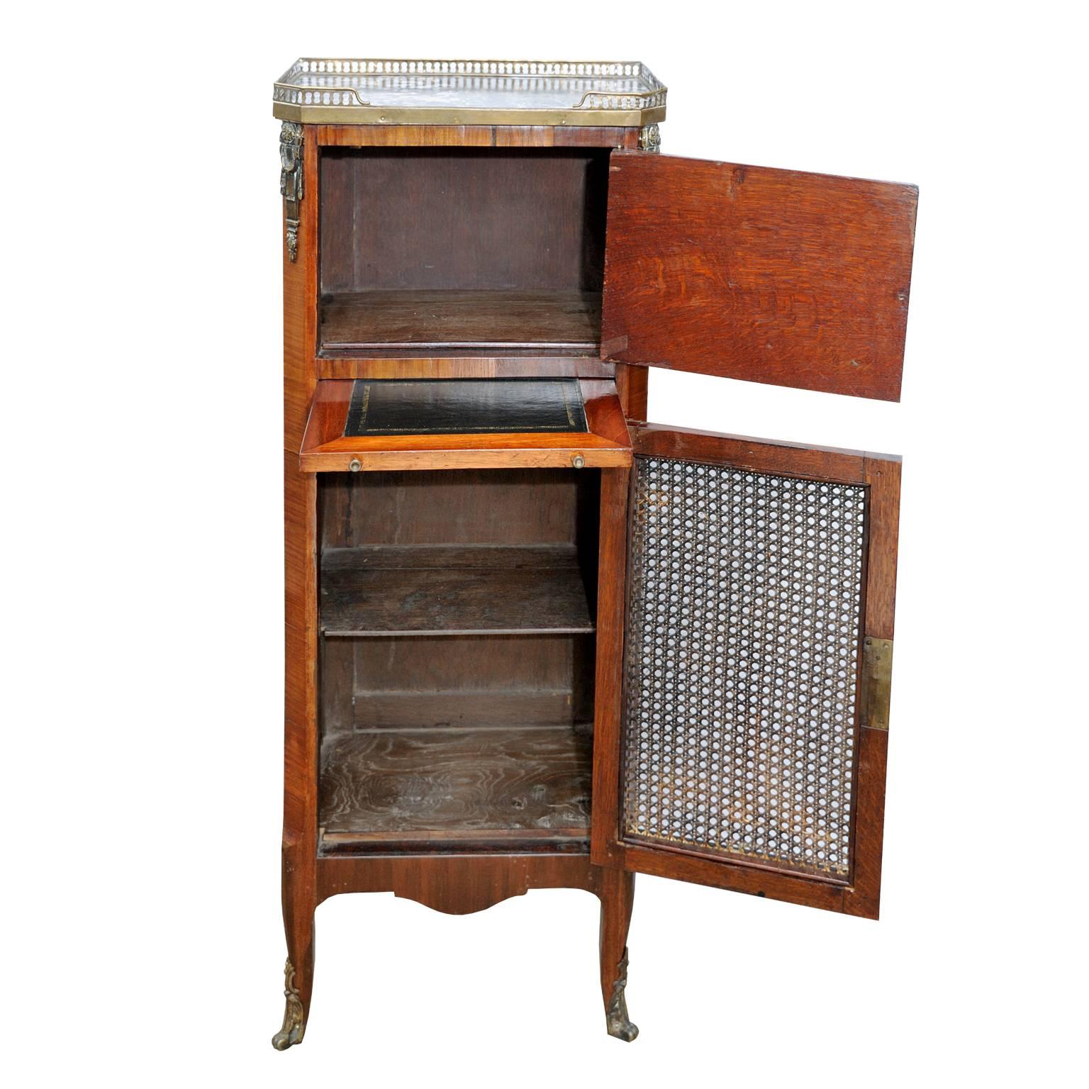 This is a rather lovely French 19th century Louis XVI style small rosewood secretaire with a marble top and brass gallery, with pull-out tooled black leather writing slide.

The top door has been finished with faux leather book spines and the