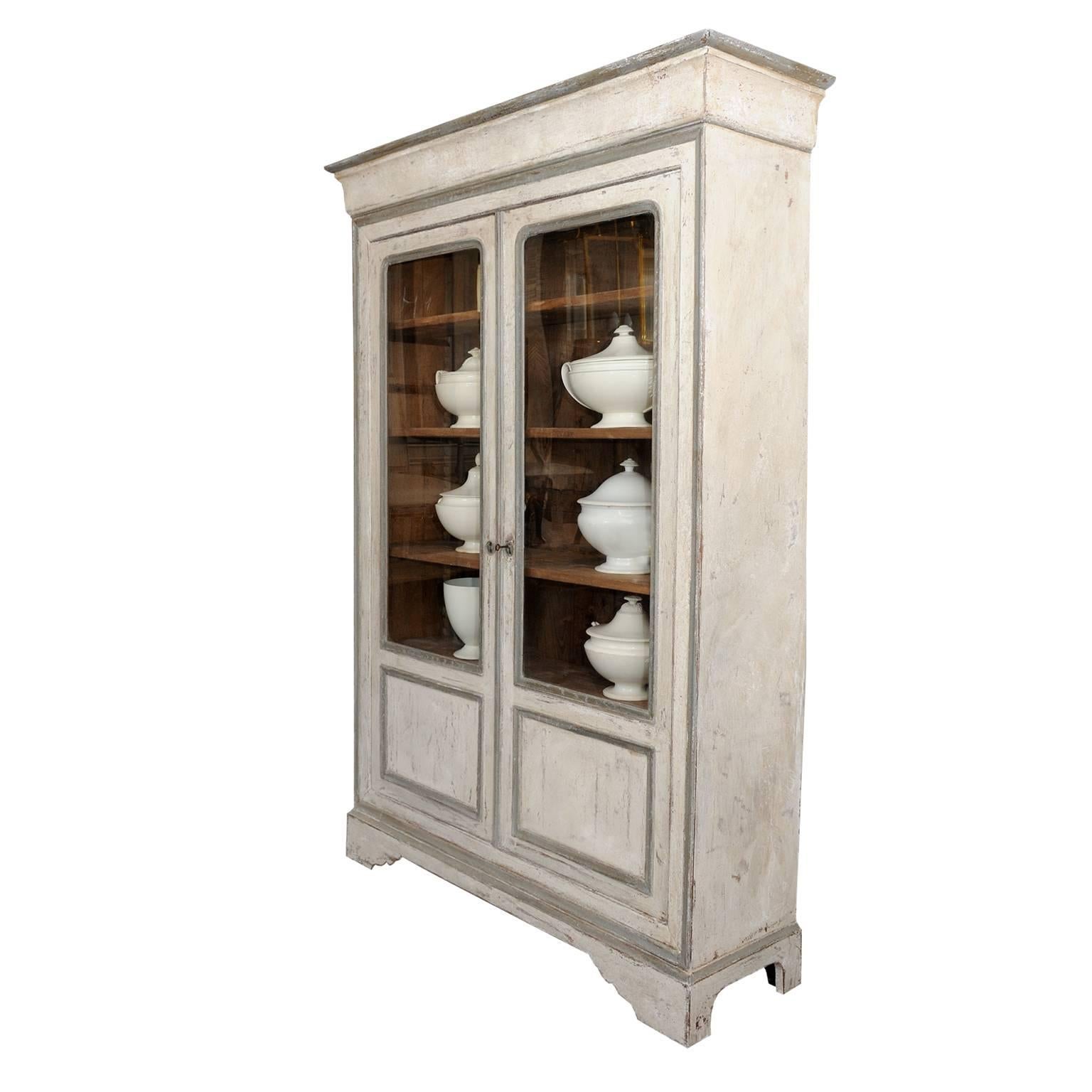 This is a large and very well proportioned French mid 19th century glazed and painted Bookcase or Cabinet, complete with four internal adjustable shelves c.1840.
